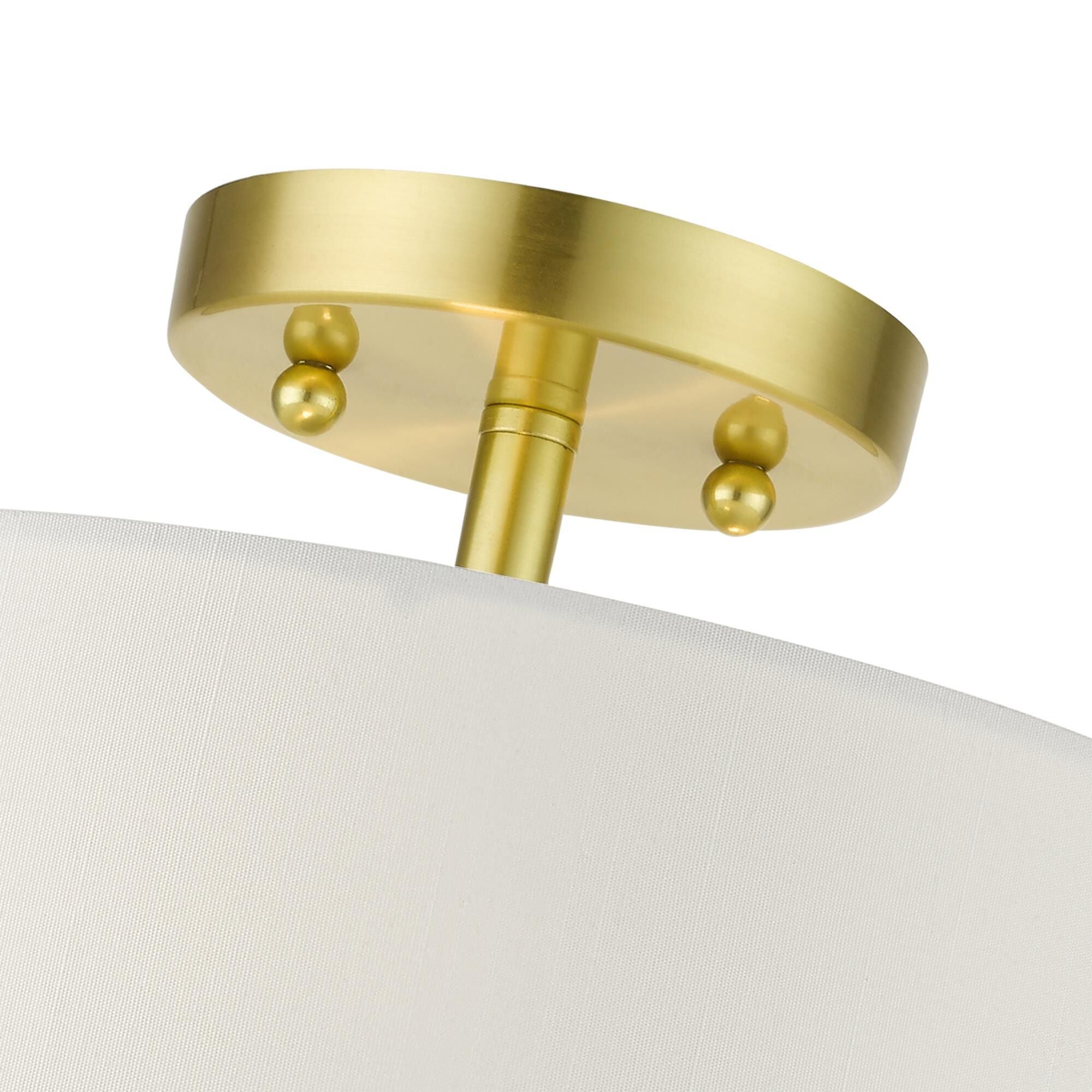 Shown in Satin Brass finish and Hand Crafted Hardback  Completely Finished With Off-White Color Fabric Outside and Inside shade