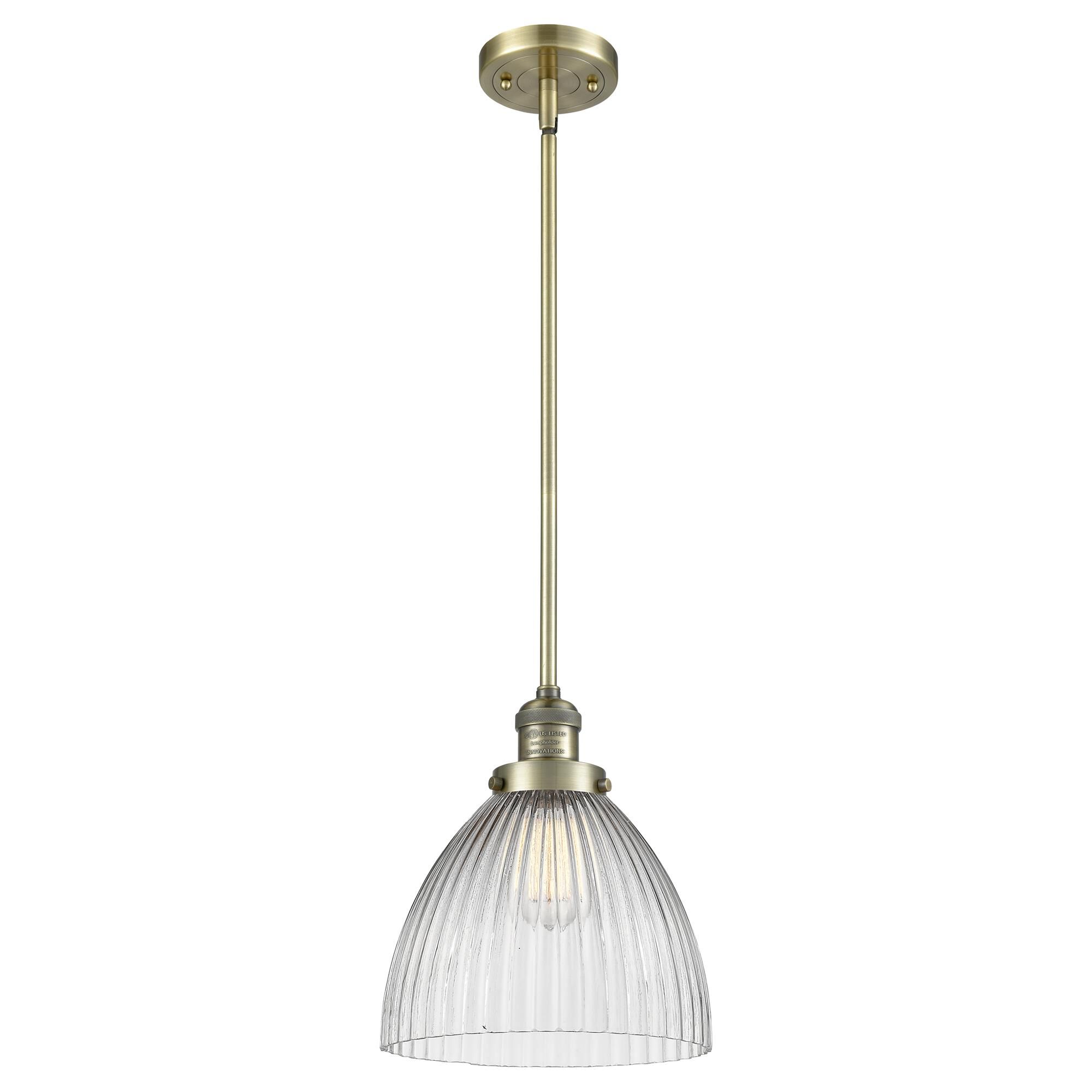 Shown in Antique Brass finish and Clear Halophane glass