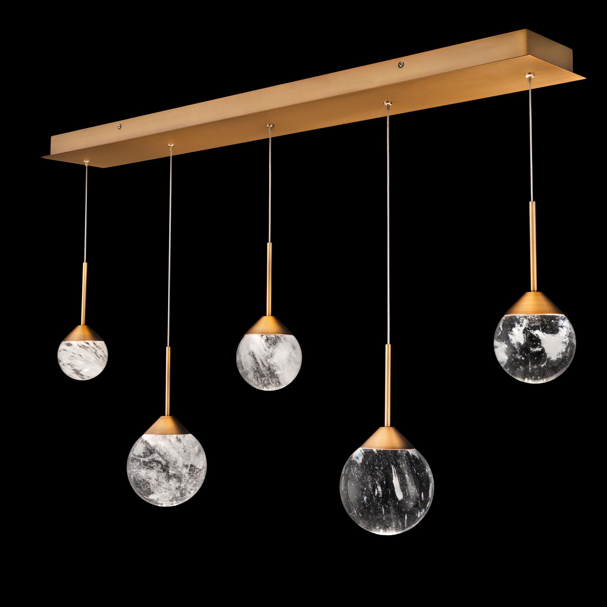 Shown in Aged Brass finish and Optic Haze Quartz Crystal crystal