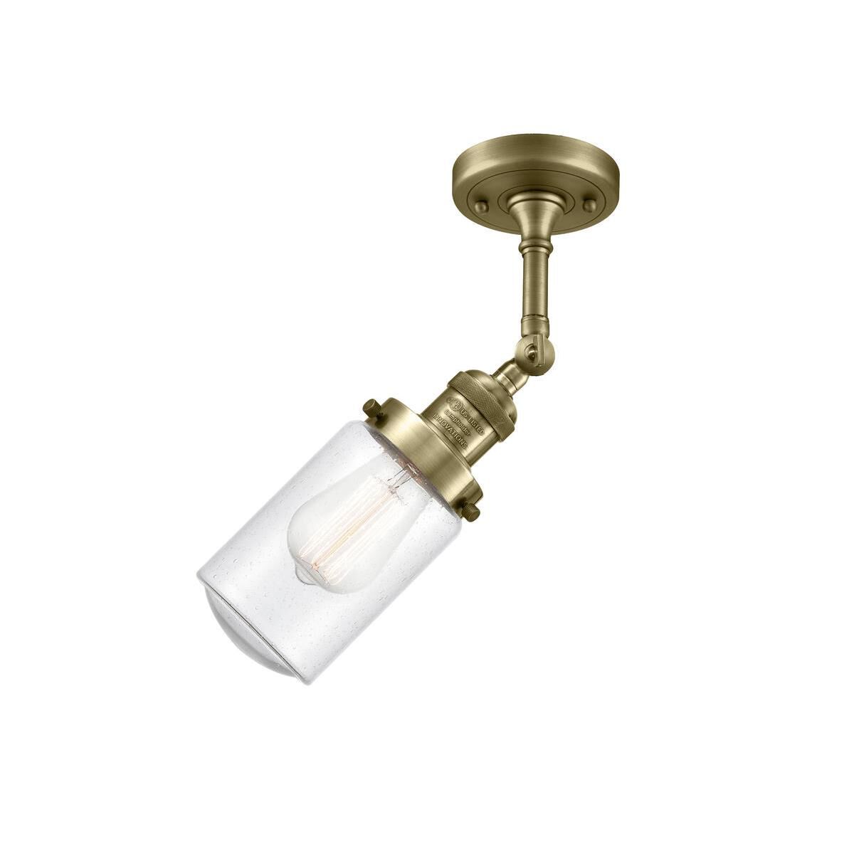 Shown in Antique Brass finish and Schoolhouse glass and Glass shade and Bulb Tint - Amber accent