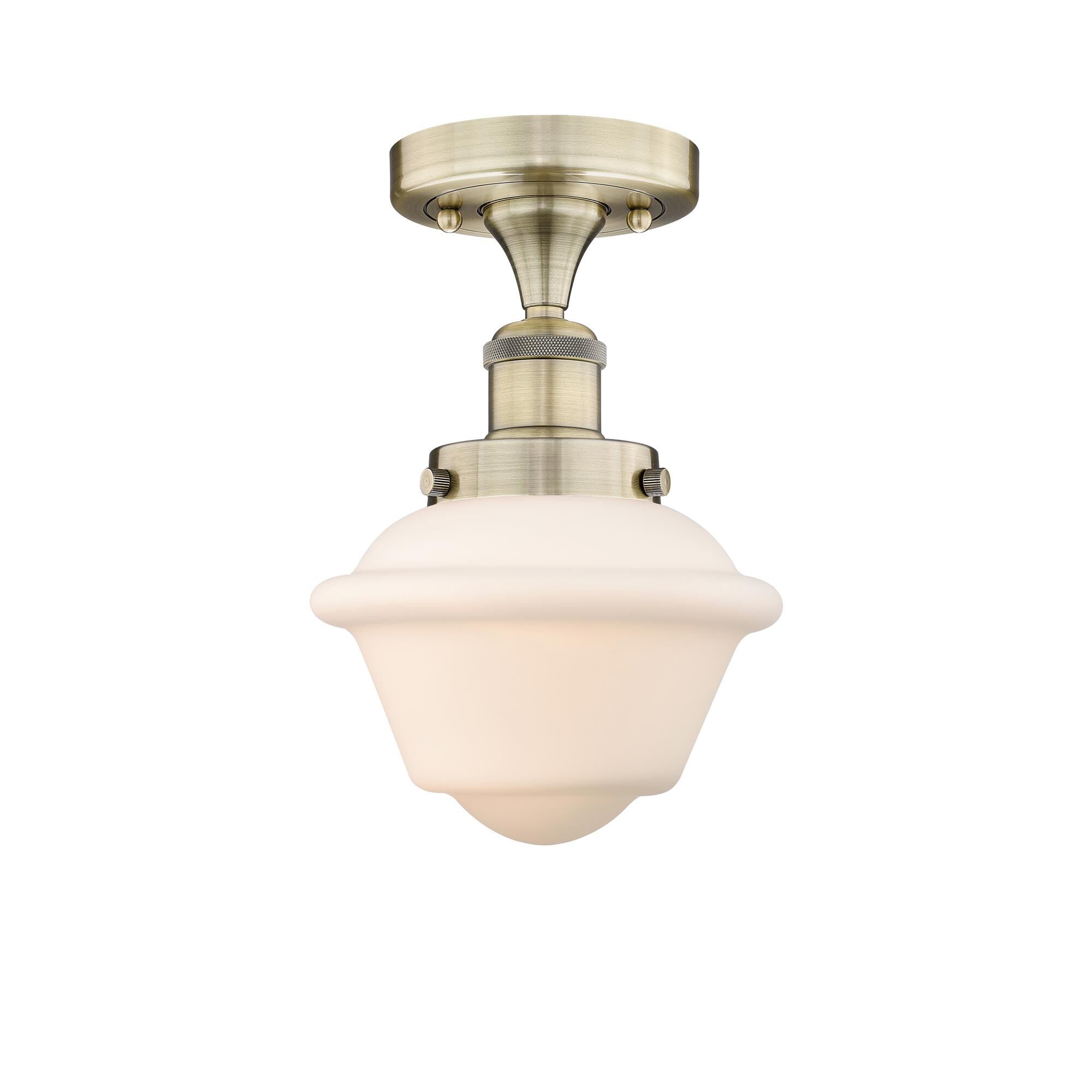 Shown in Antique Brass finish and Matte White glass