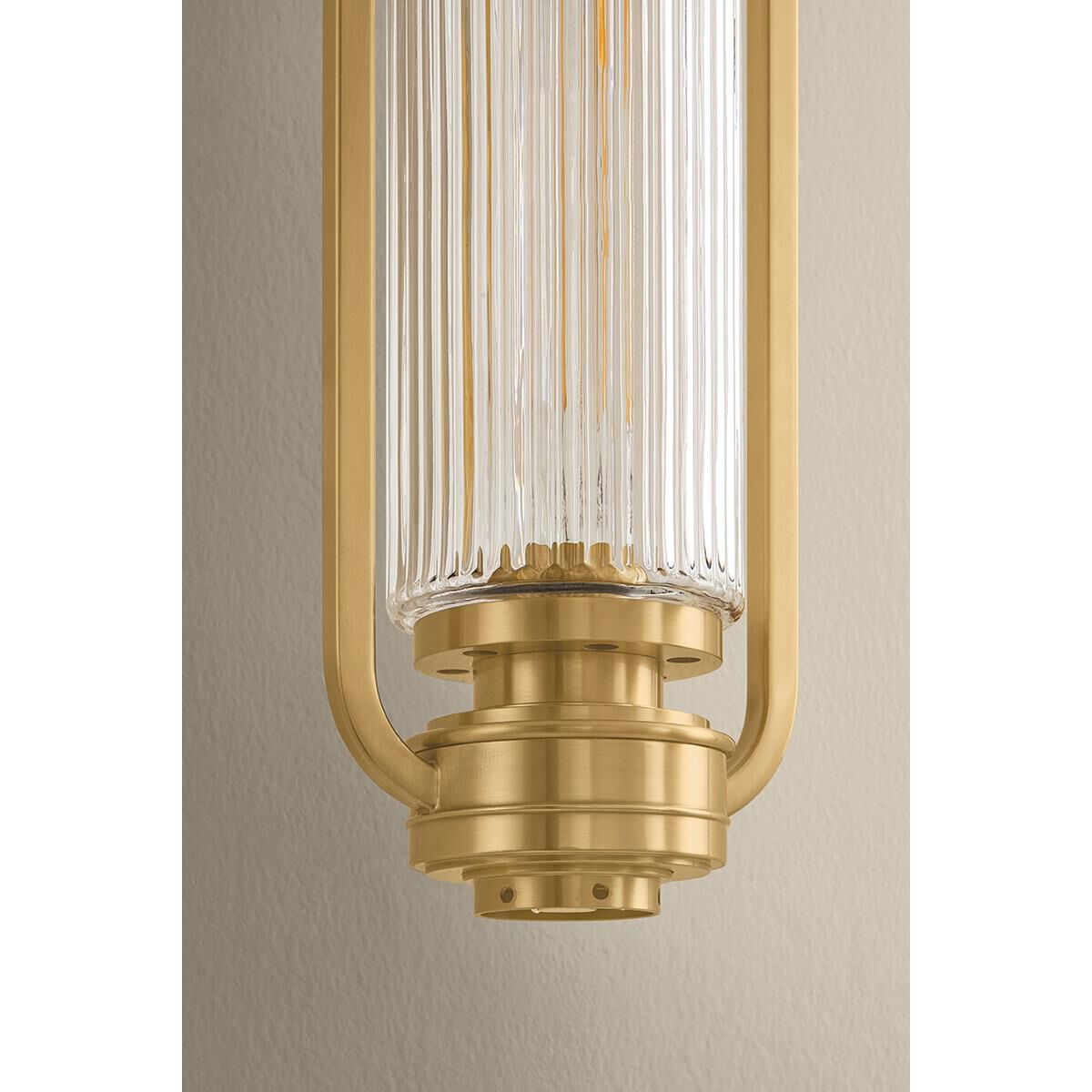 Shown in Aged Brass finish and Clear Optic glass