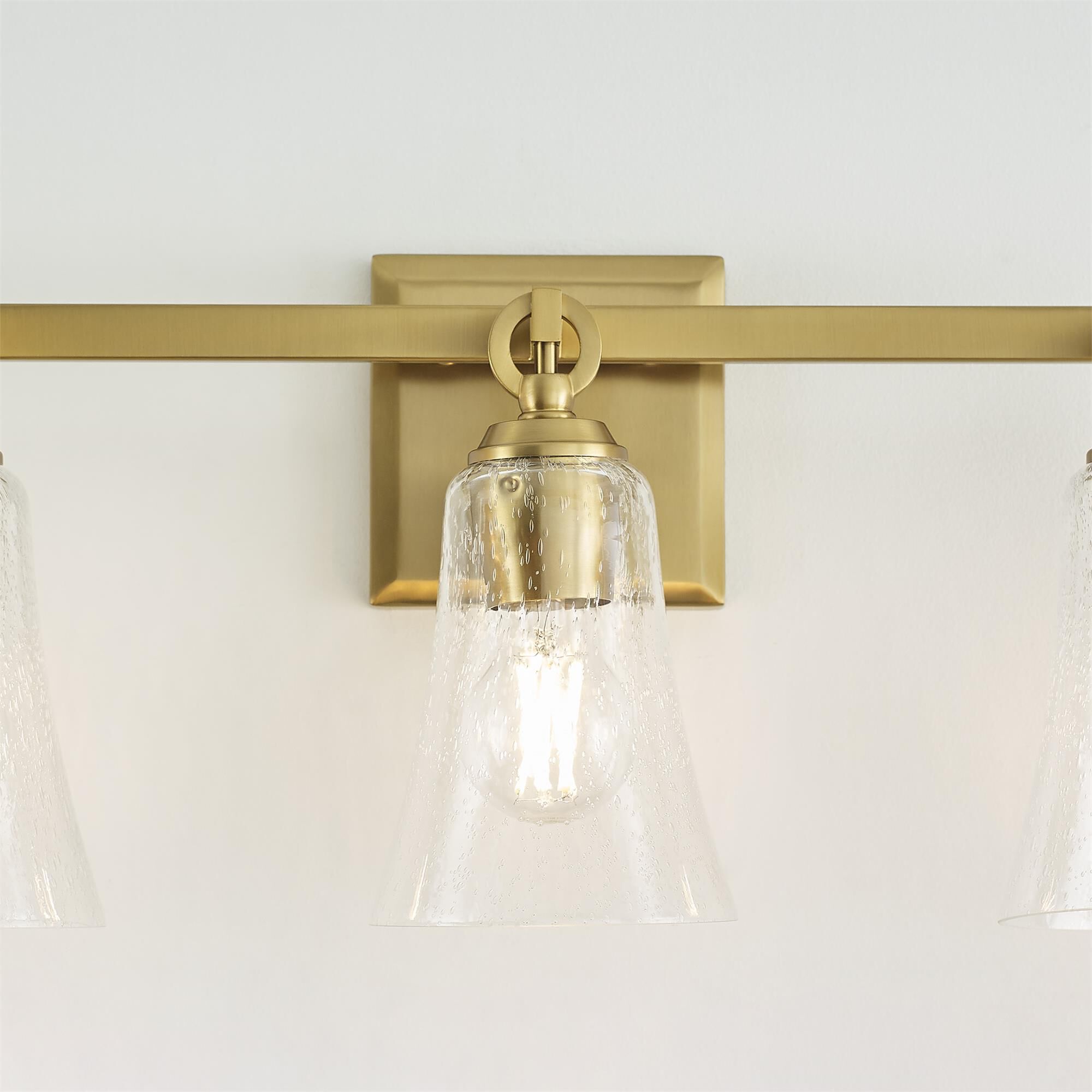 Shown in Burnished Brass finish and Clear Seeded glass