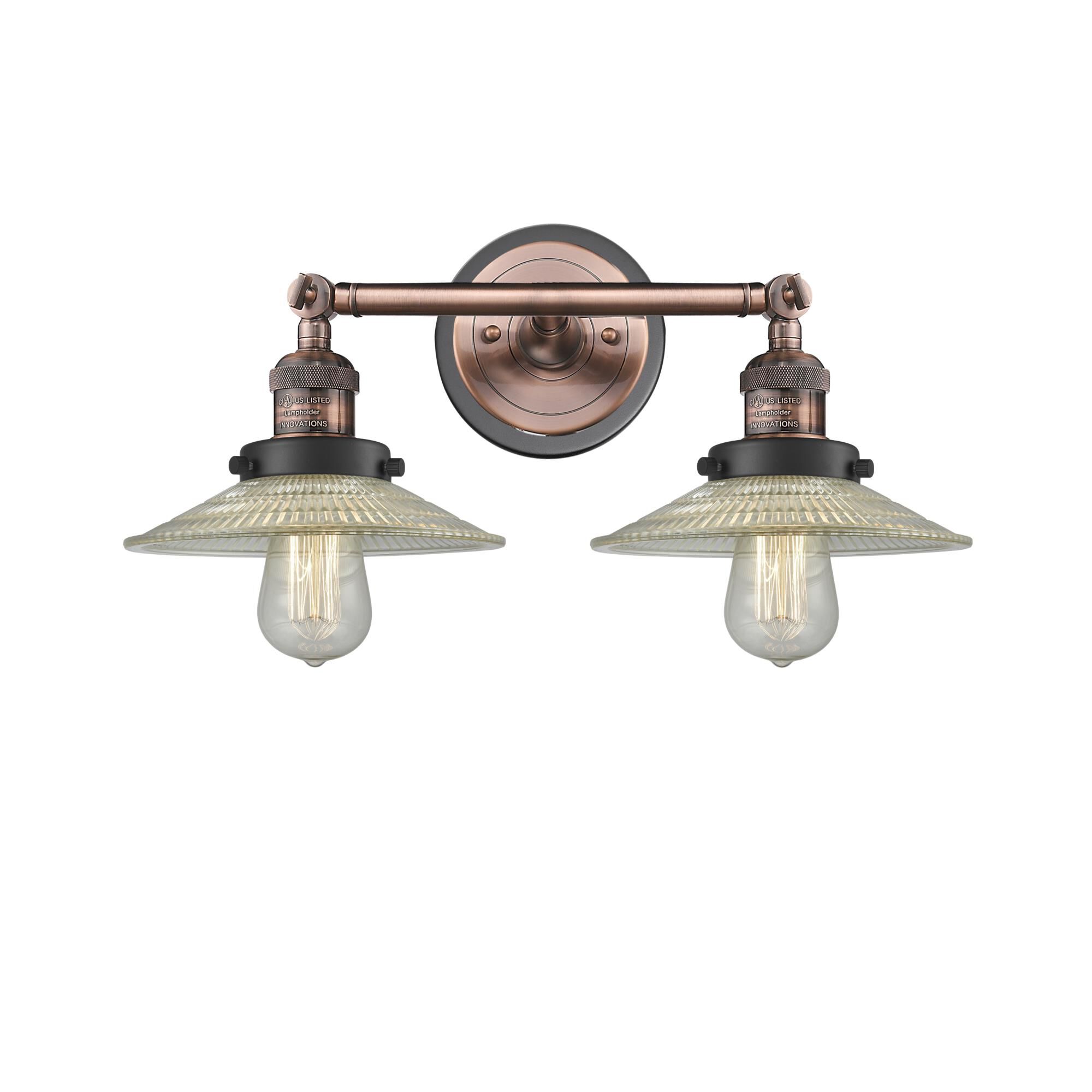 Shown in Antique Copper finish and Clear Halophane glass and Matte Black accent