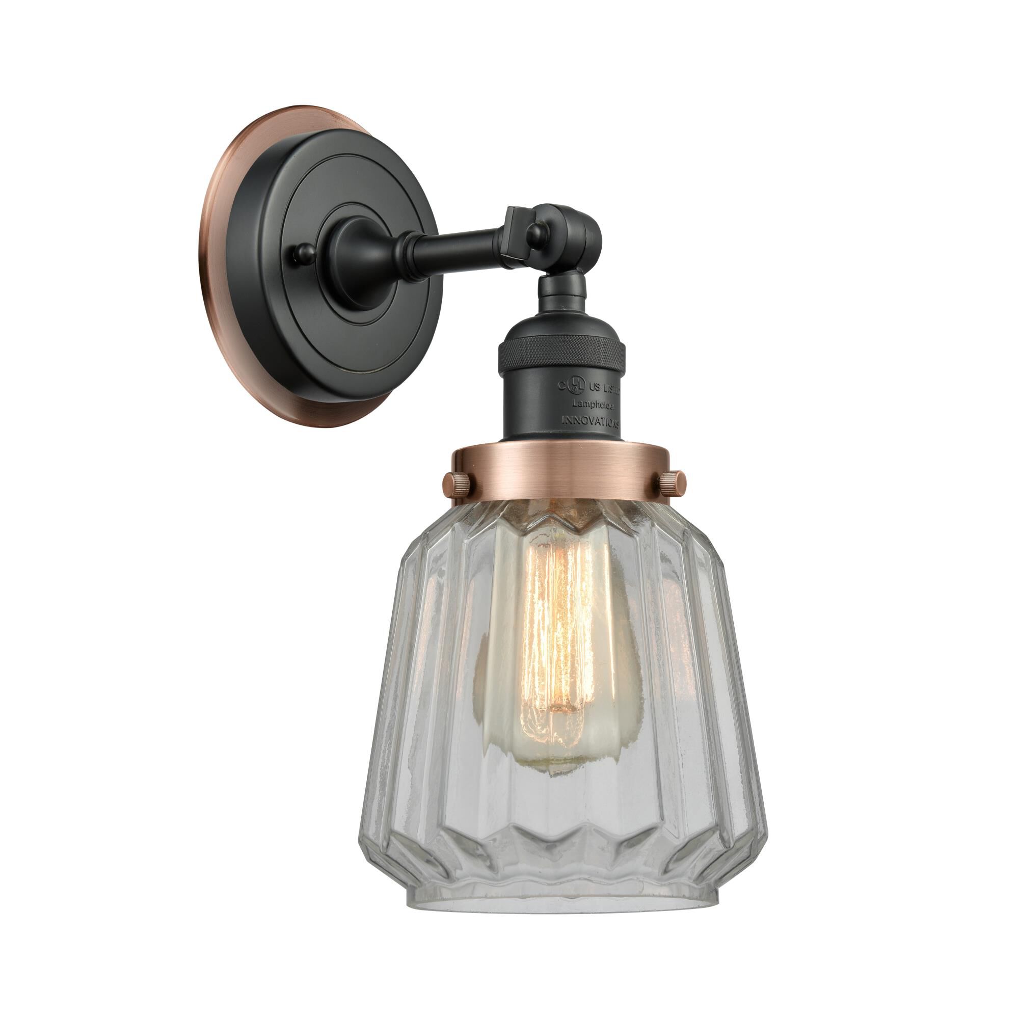 Shown in Matte Black finish and Clear Chatham glass and Antique Copper Fitter accent
