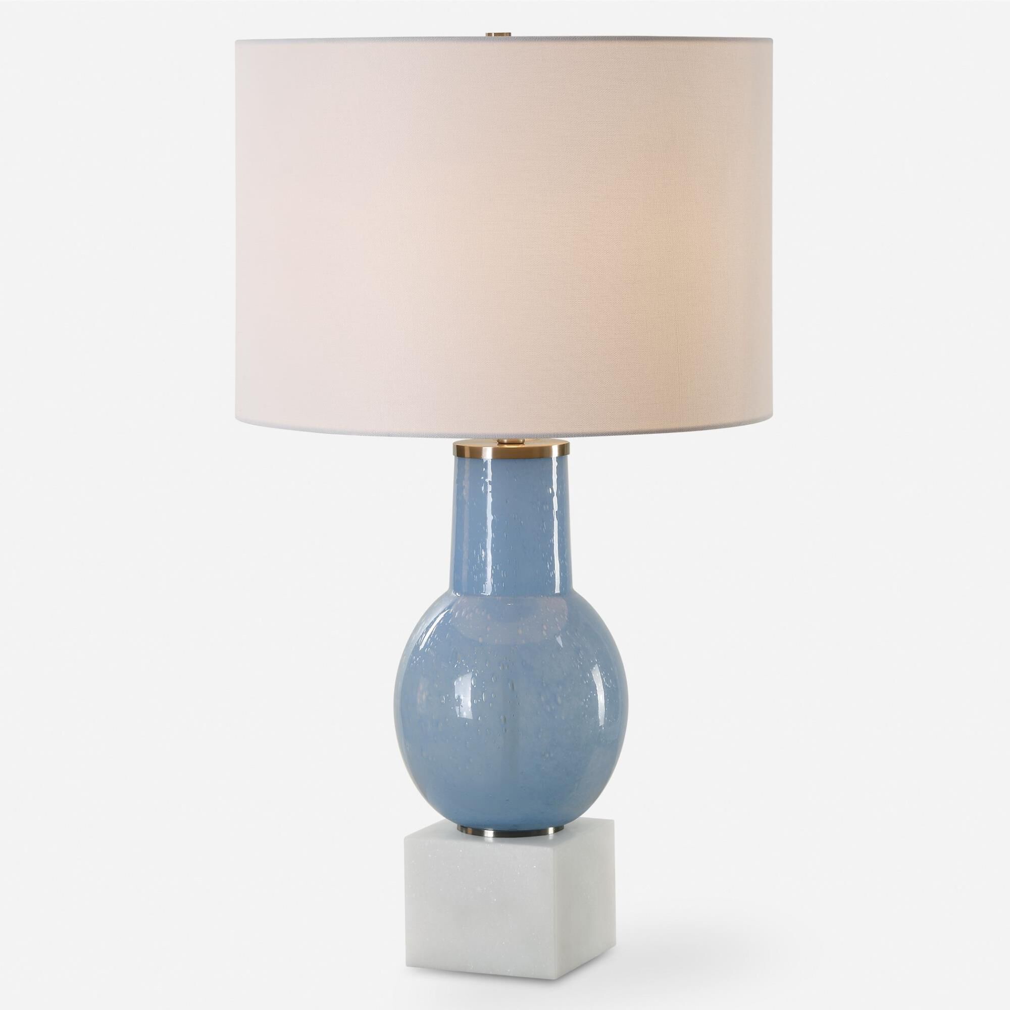 Shown in This Table Lamp Features A Sky Blue Seeded Glass Body Atop A Sturdy White Marble Foot With Brushed N finish and Round Drum Hardback shade