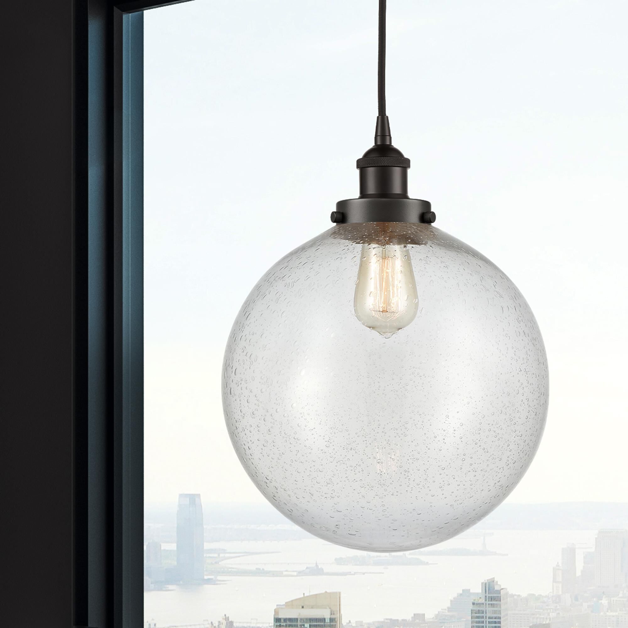 Shown in Oil Rubbed Bronze finish and Seedy Beacon glass