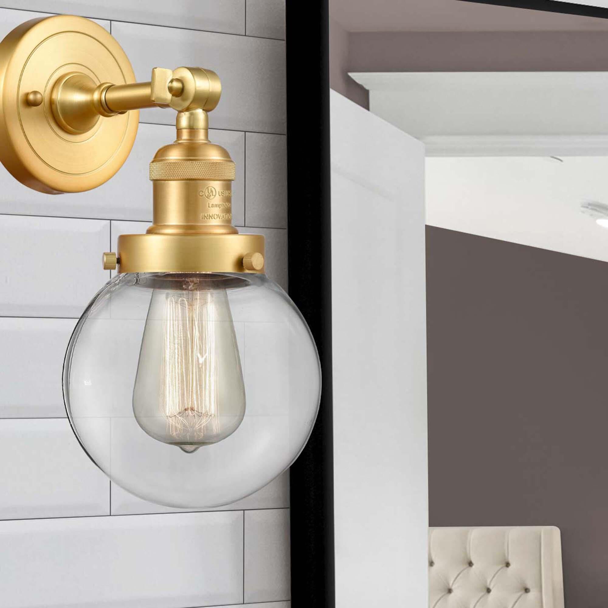 Shown in Satin Gold finish and Clear Beacon glass