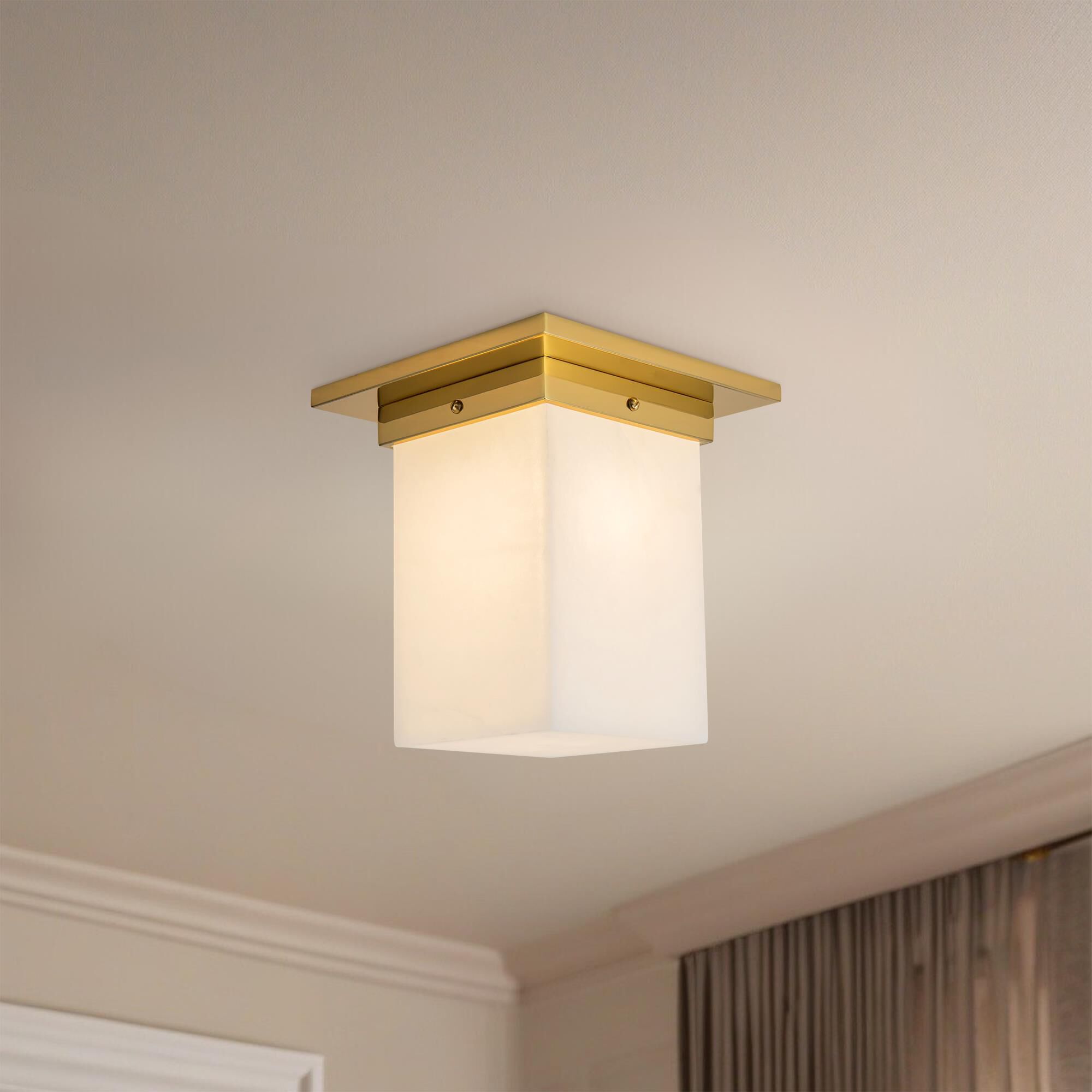 Shown in Patina Brass finish and Alabaster glass