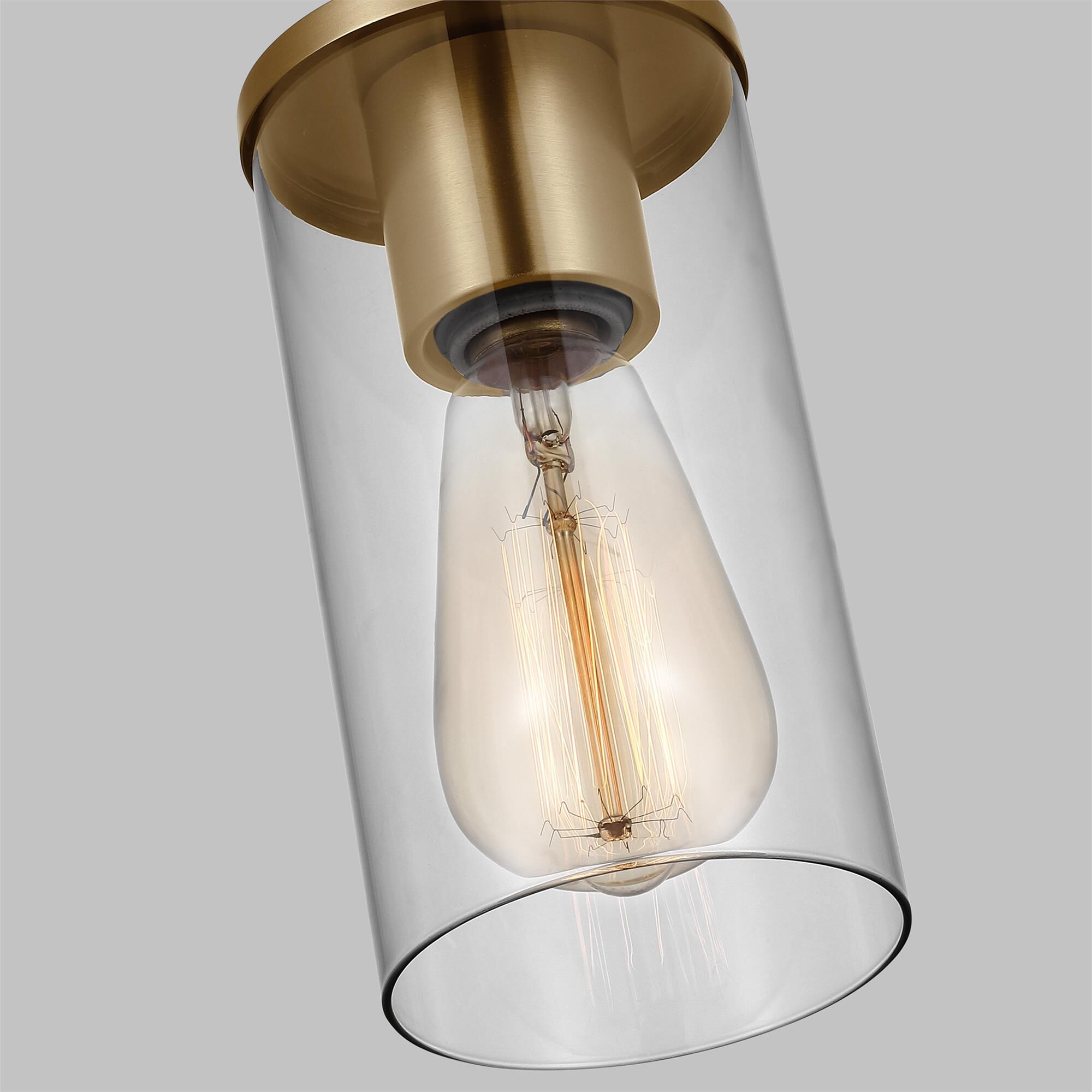 Shown in Satin Brass finish and Clear Glass shade