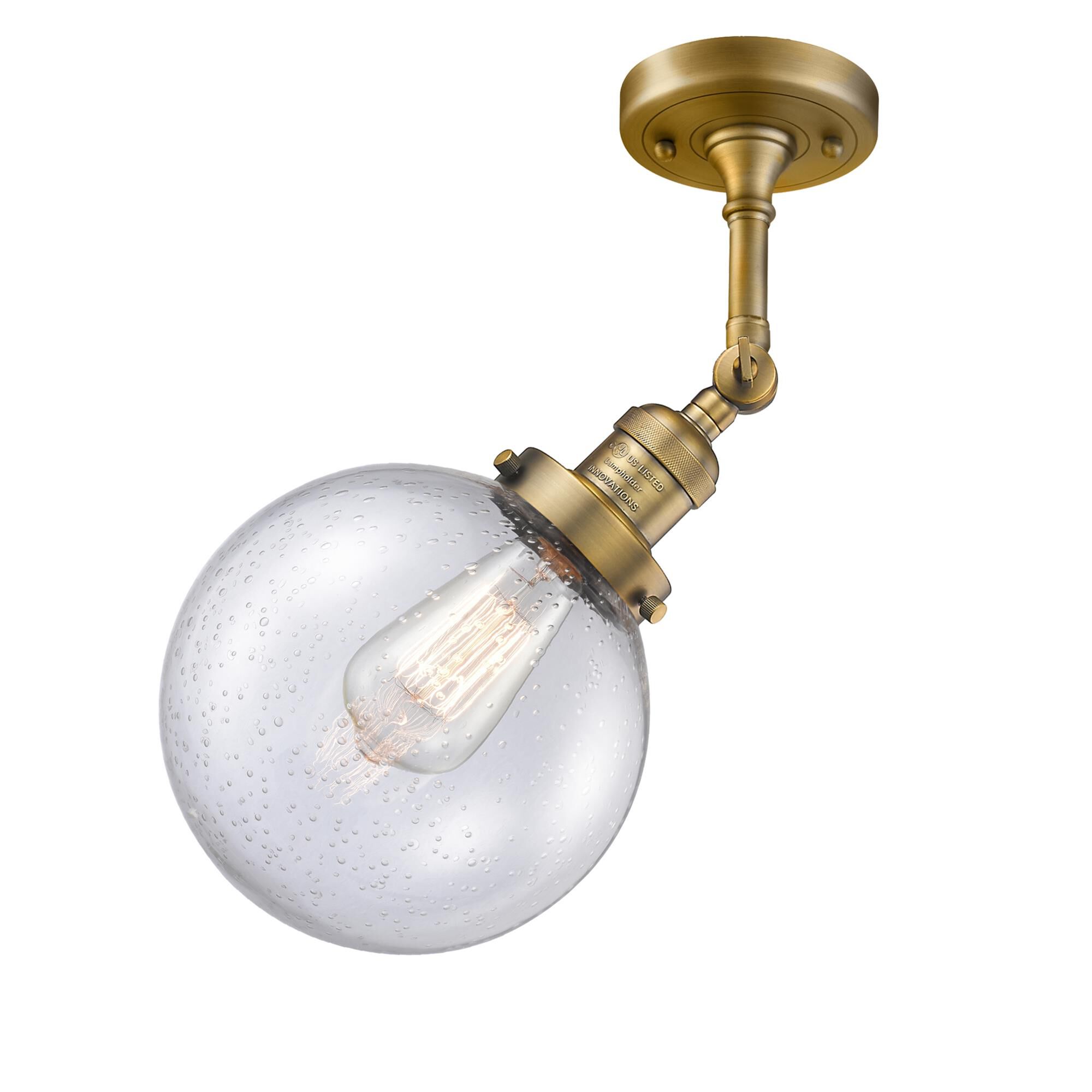 Shown in Brushed Brass finish and Seedy glass and No Accent accent