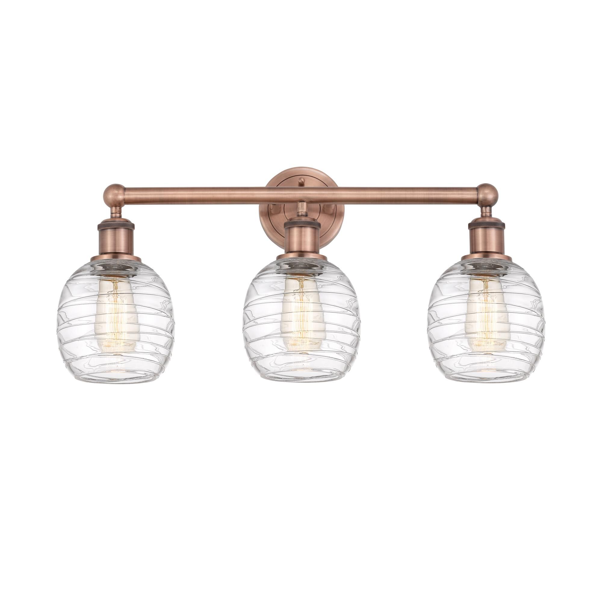 Shown in Antique Copper finish and Deco Swirl glass