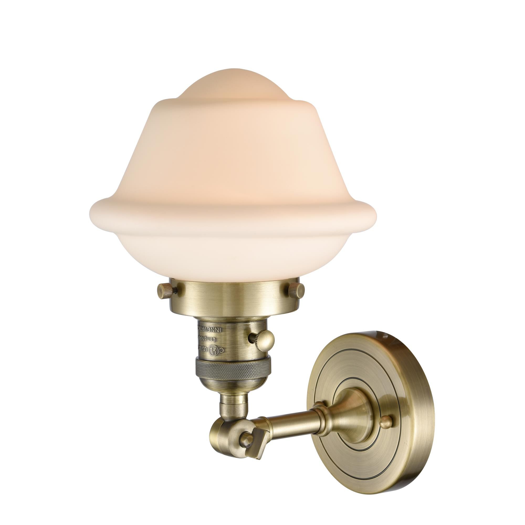 Shown in Antique Brass finish and Matte White Cased glass and Switch on Socket accent