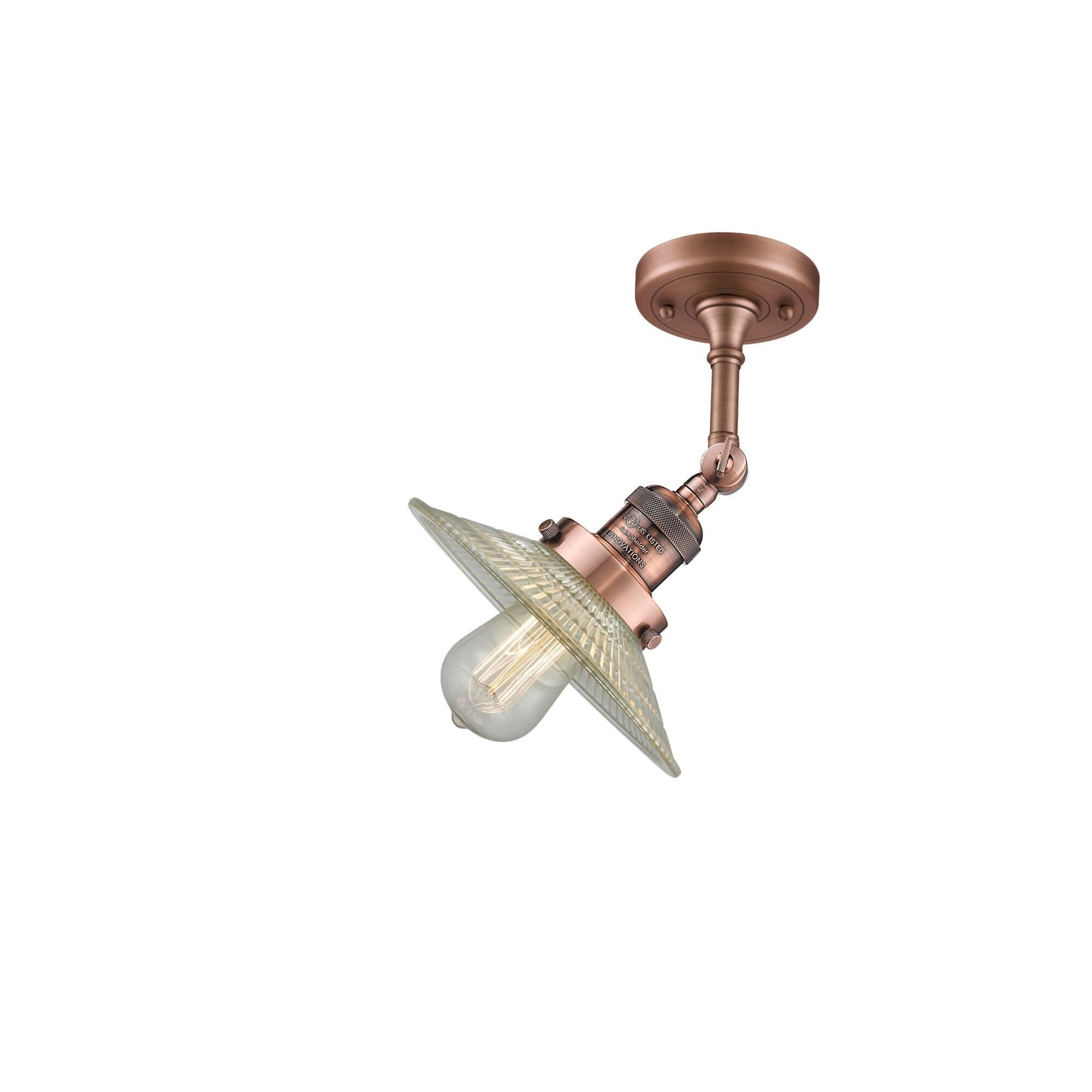 Shown in Antique Copper finish and Clear Halophane glass