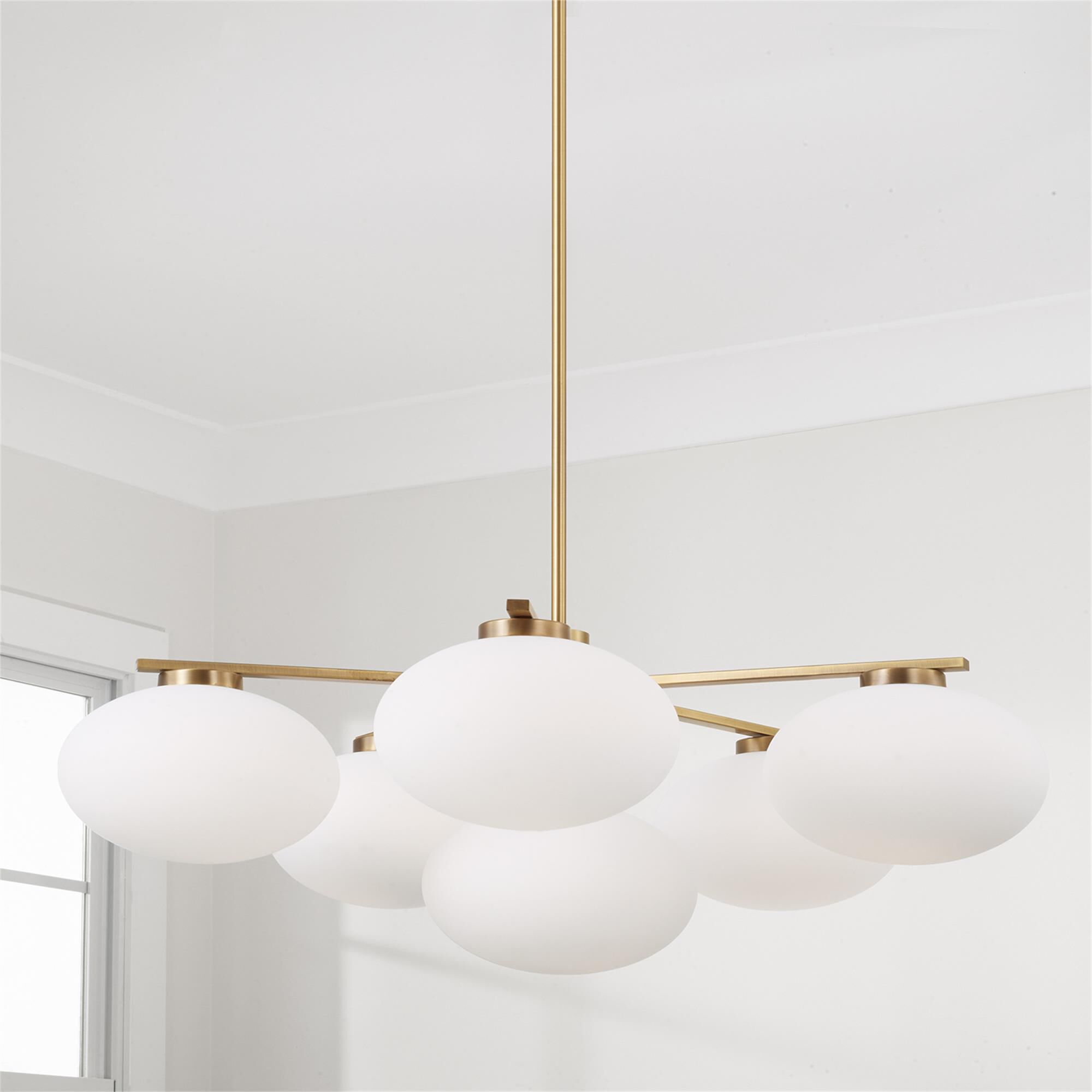 Shown in Aged Brass finish and Soft White glass