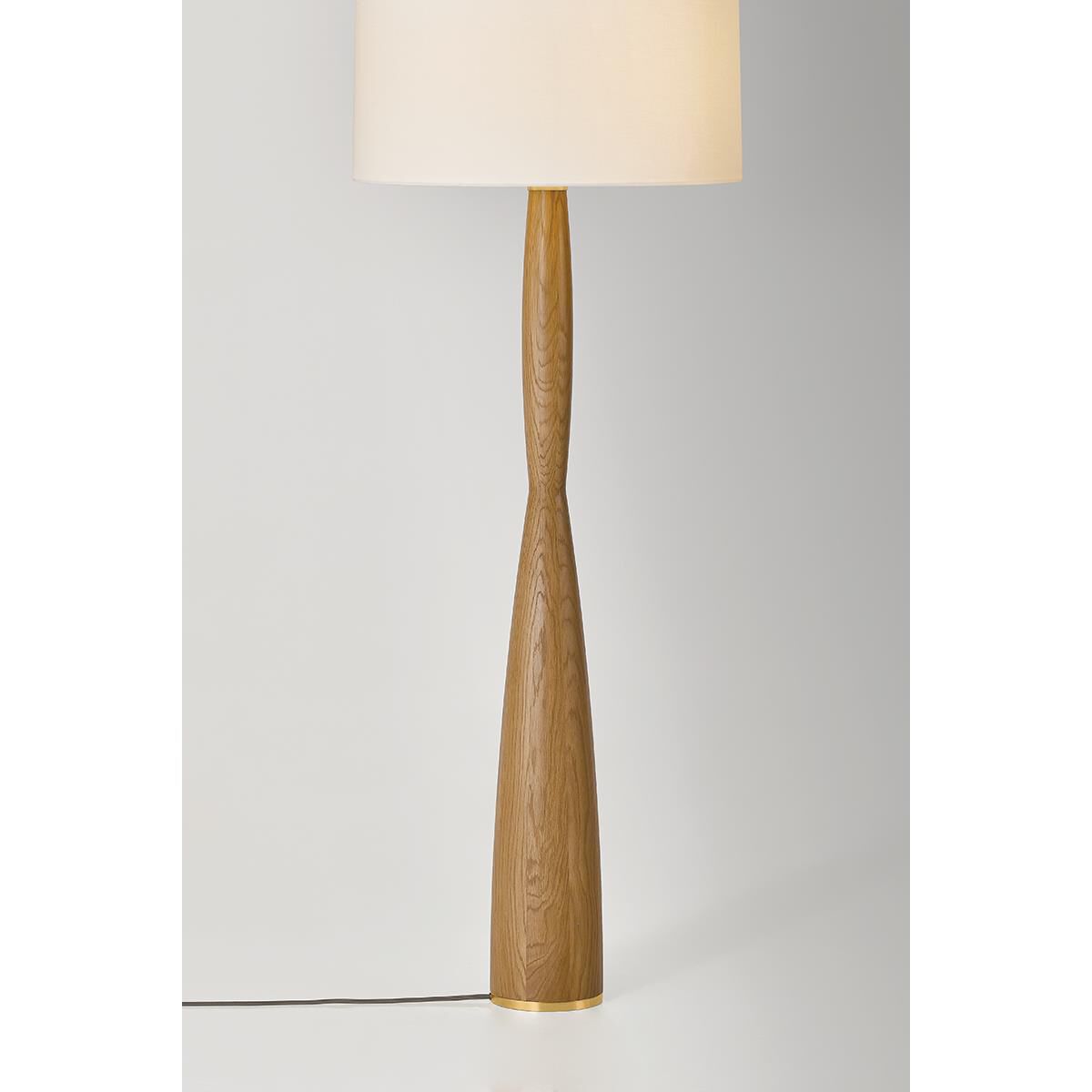 Shown in Aged Brass finish and White Linen shade