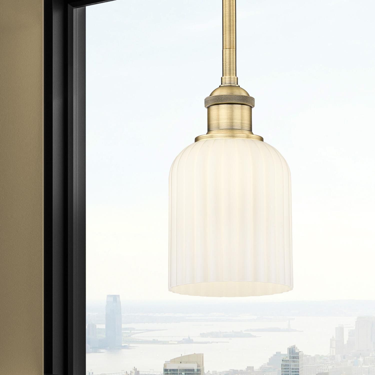 Shown in Brushed Brass finish and Gloss White glass