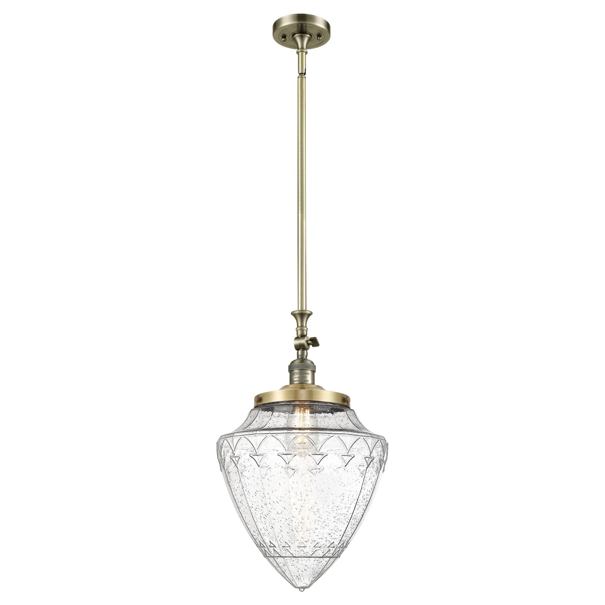 Shown in Antique Brass finish and Seedy glass