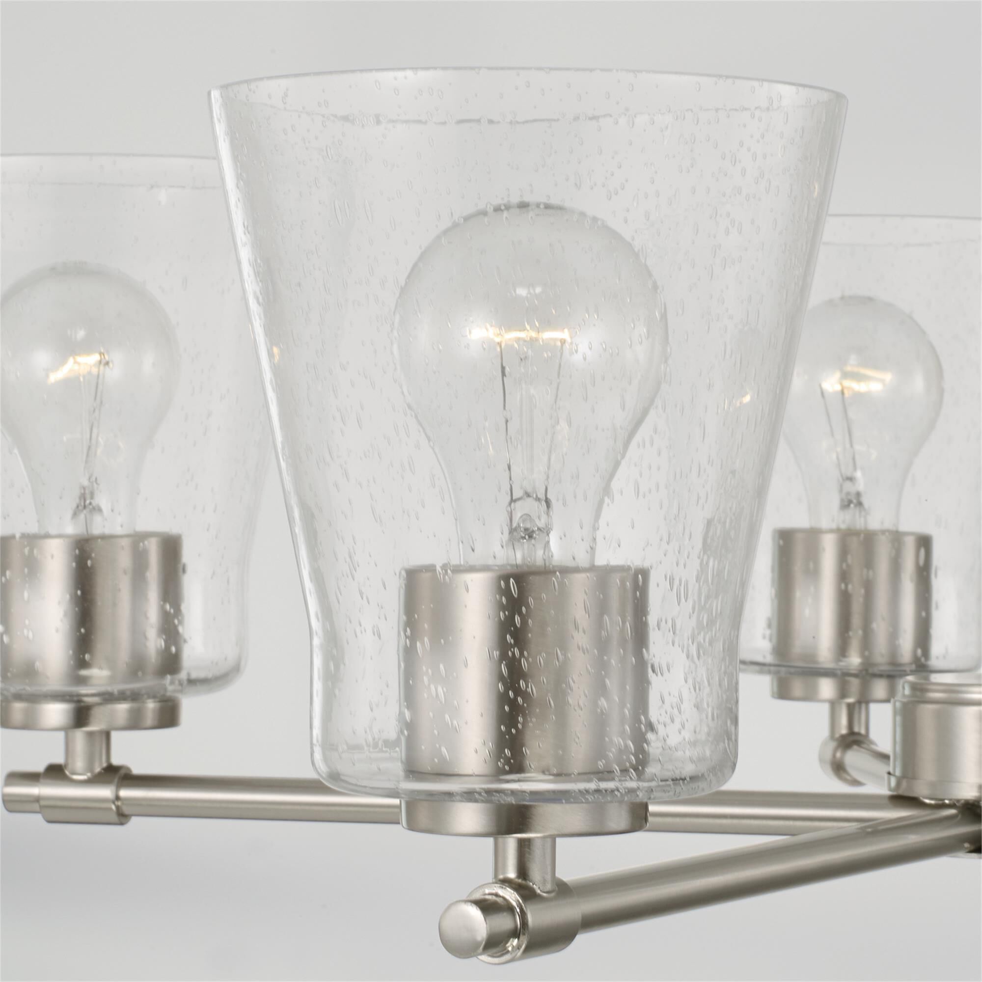 Shown in Brushed Nickel finish and Clear Seeded glass