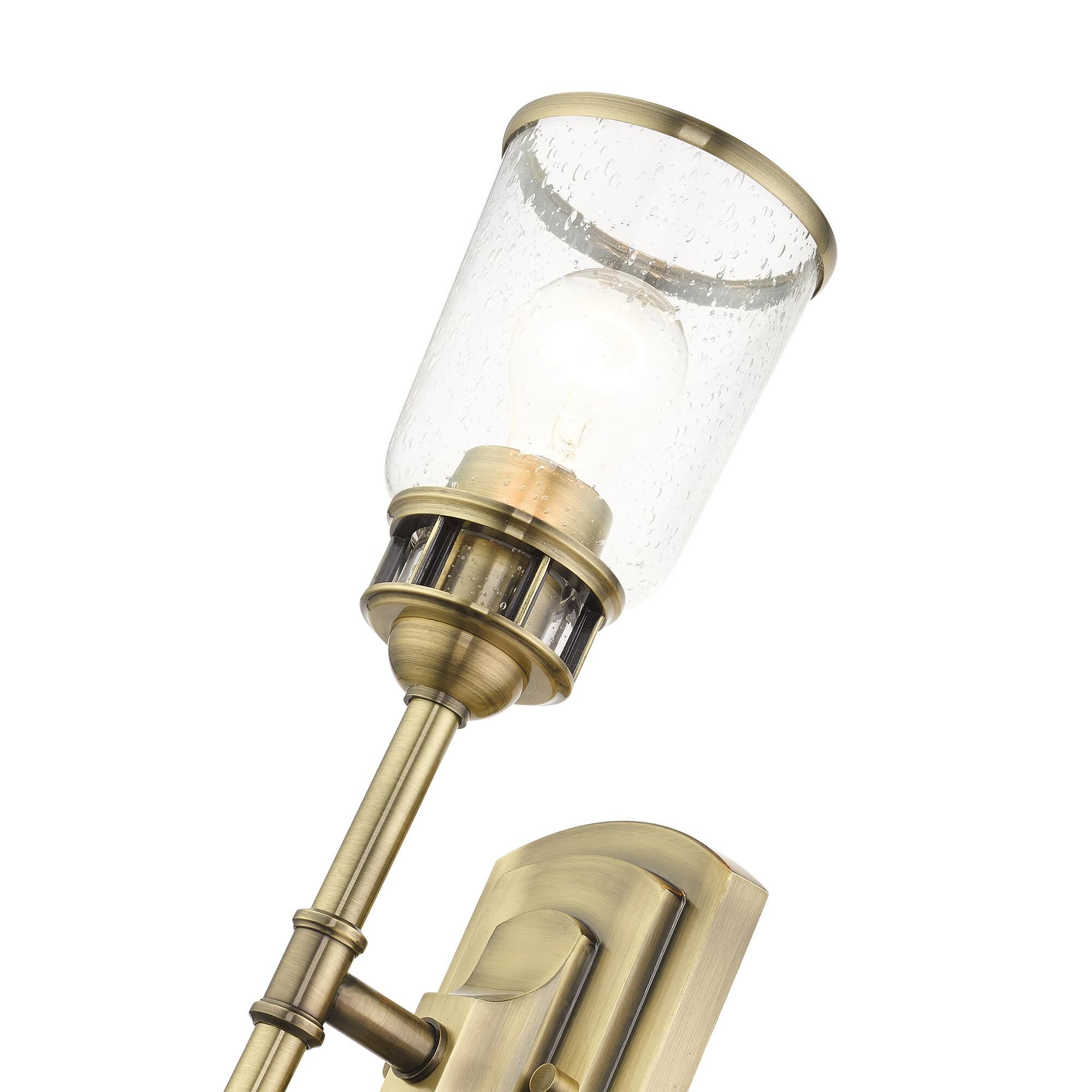 Shown in Antique Brass finish and Hand Blown Clear Seeded glass and Hand Blown Clear Seeded Glass shade