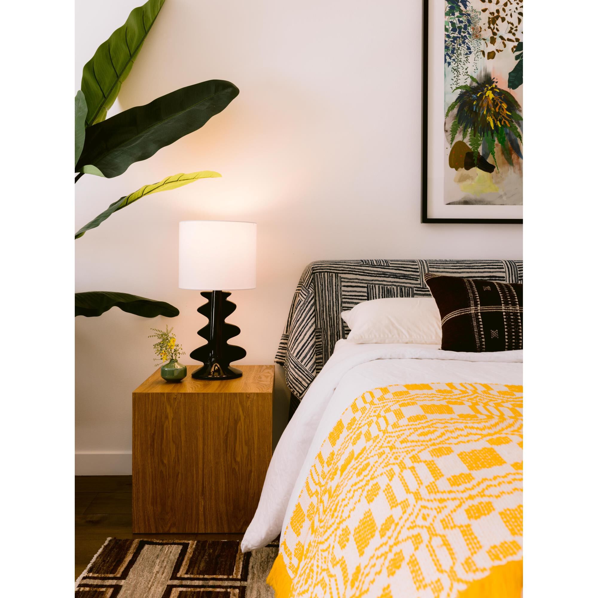 Shown in Aged Brass and Ceramic Gloss Black finish and White Linen shade