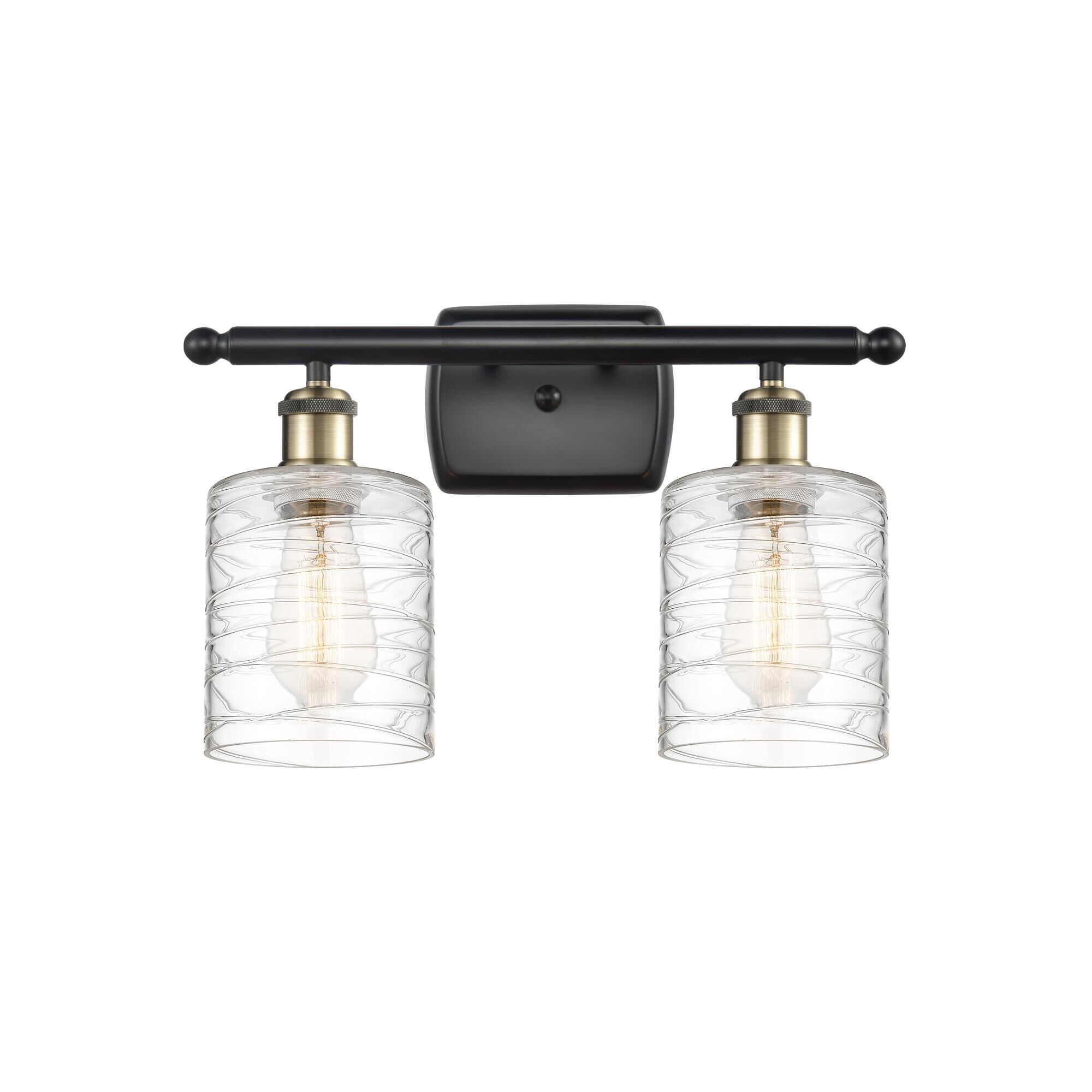 Shown in Black Antique Brass finish and Deco Swirl Cobbleskill glass