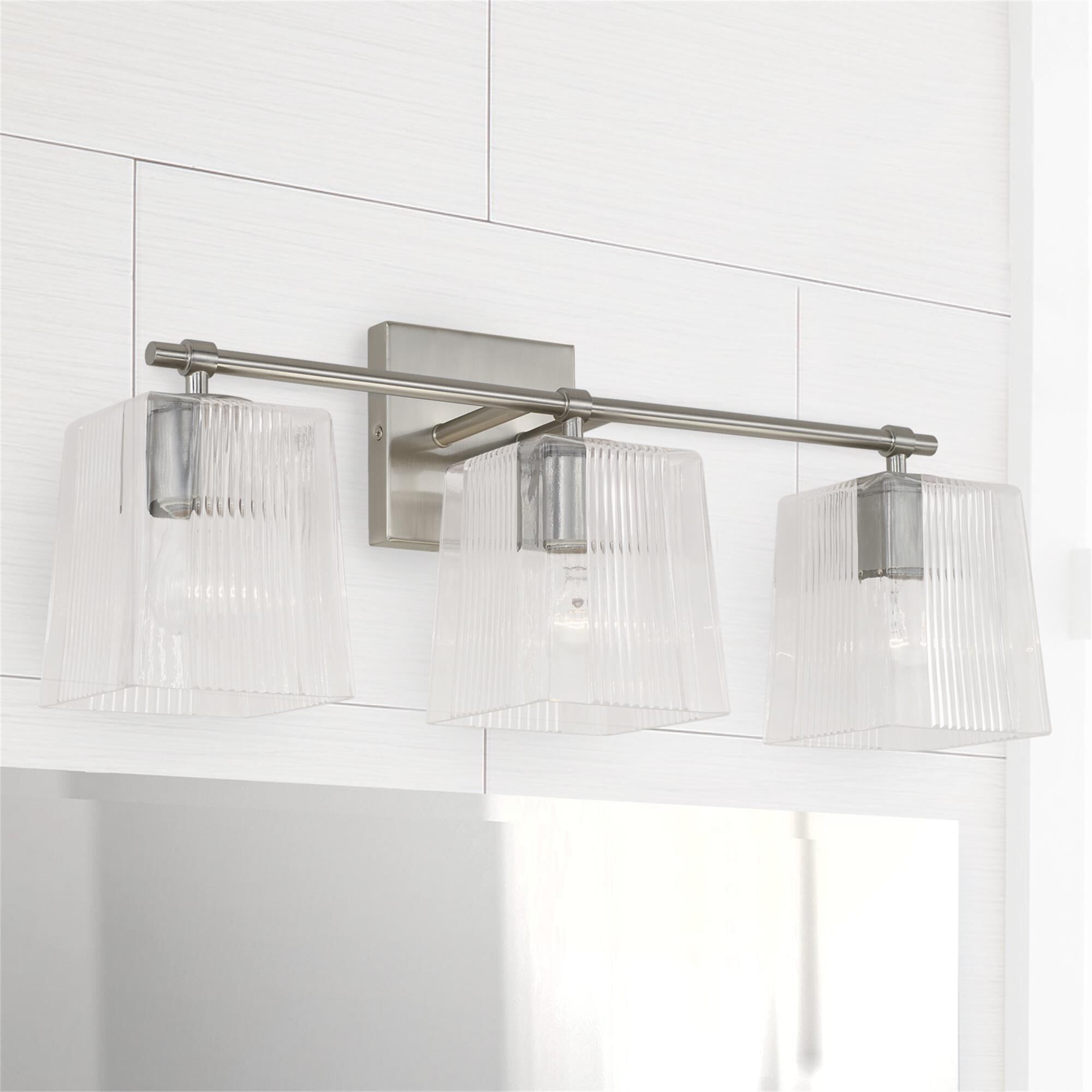 Shown in Brushed Nickel finish and Clear Fluted glass