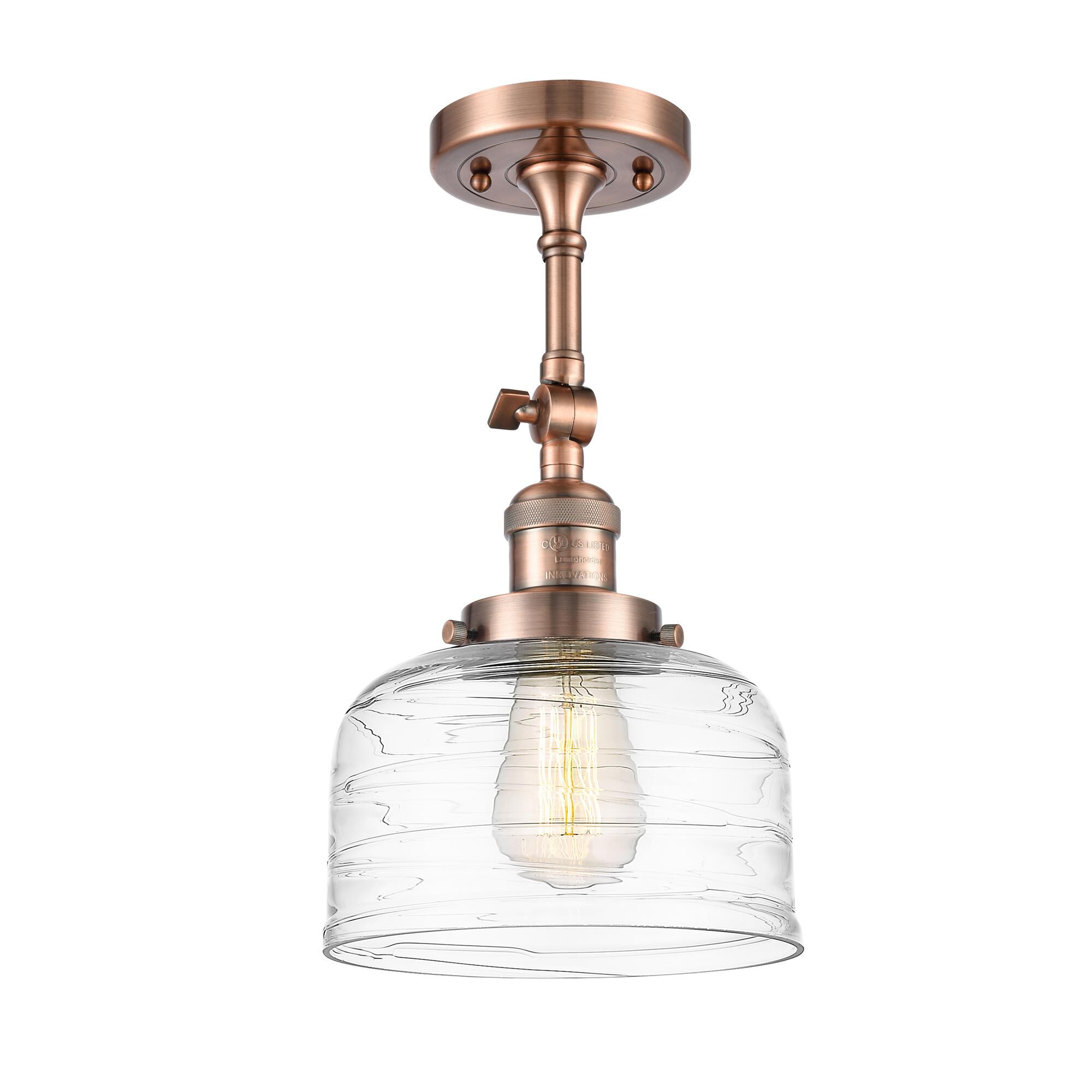 Shown in Antique Copper finish and Clear Deco Swirl Large Bell glass
