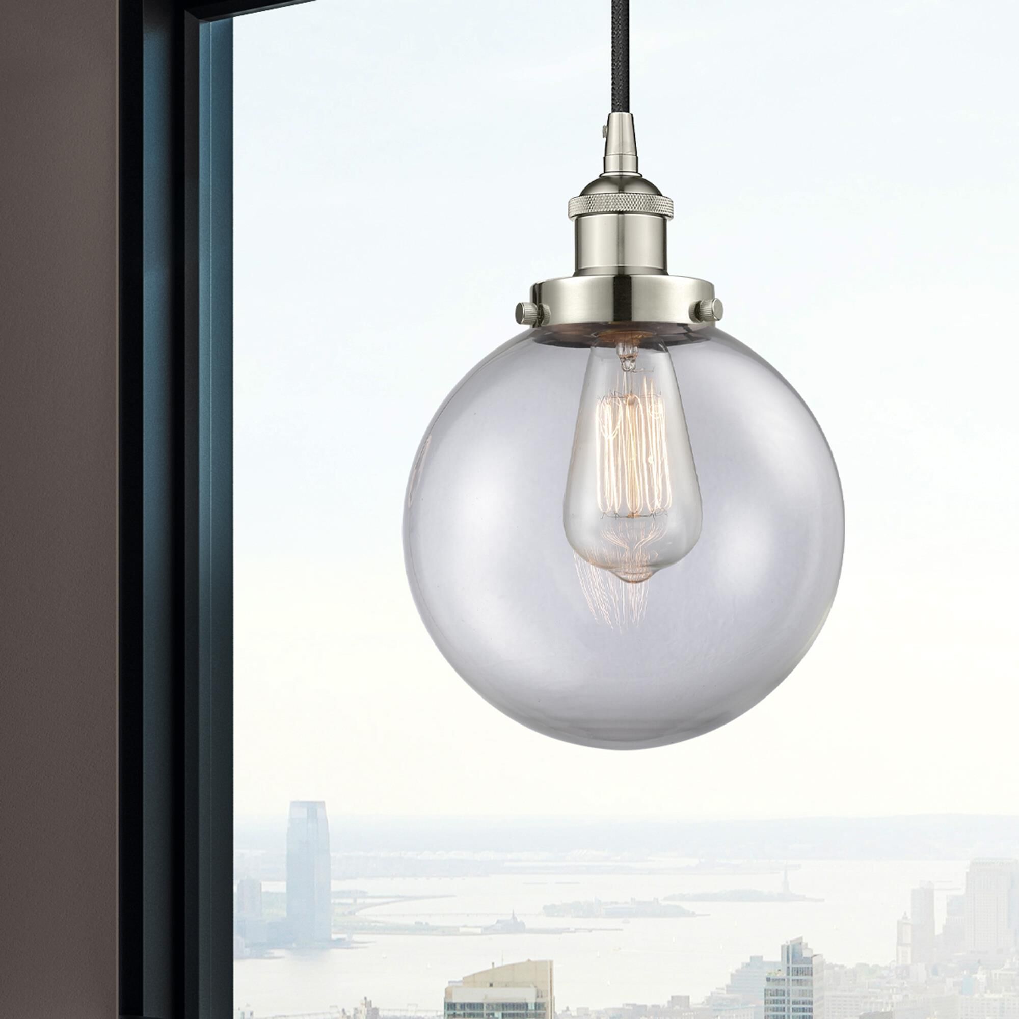 Shown in Polished Nickel finish and Clear Beacon glass