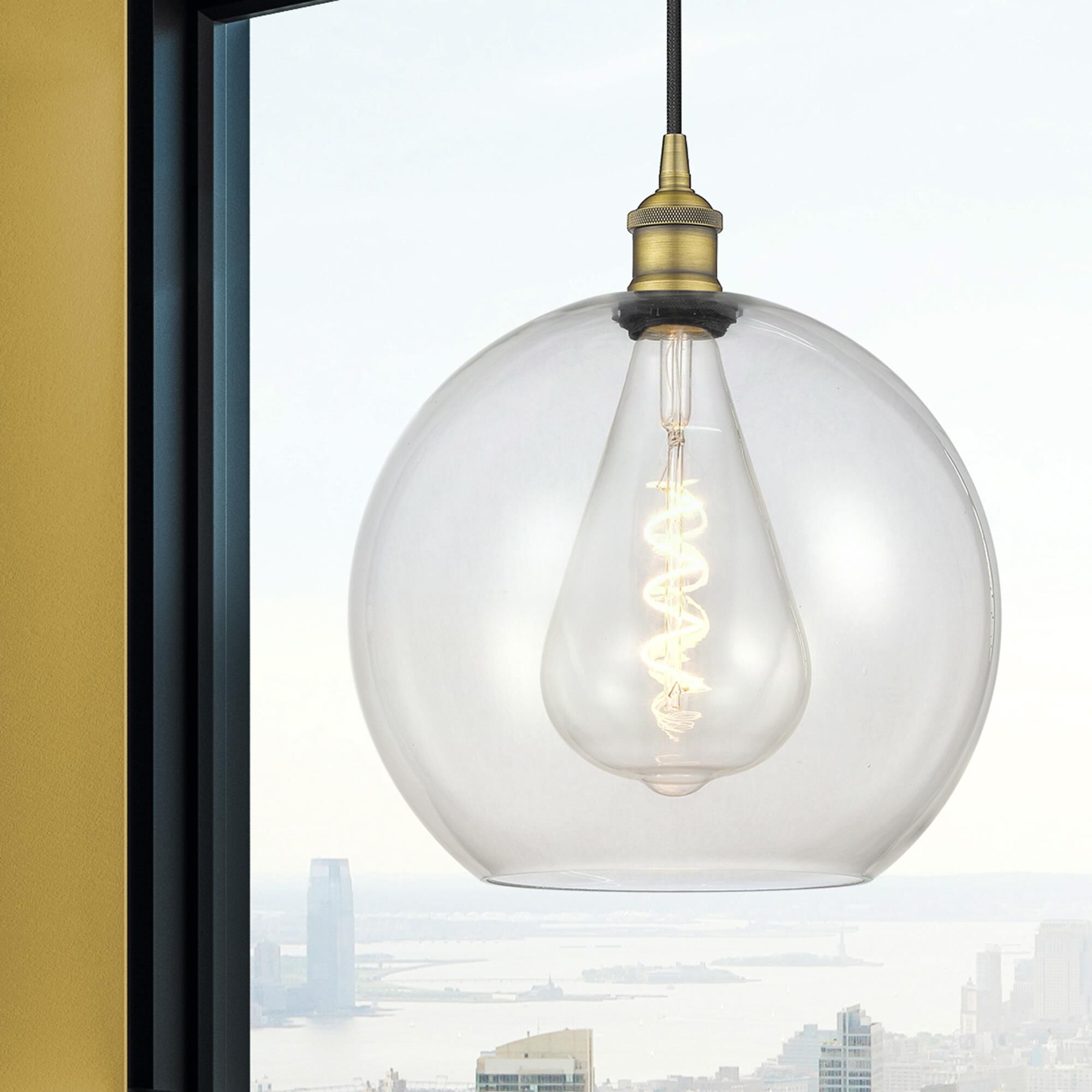 Shown in Brushed Brass finish and Clear glass