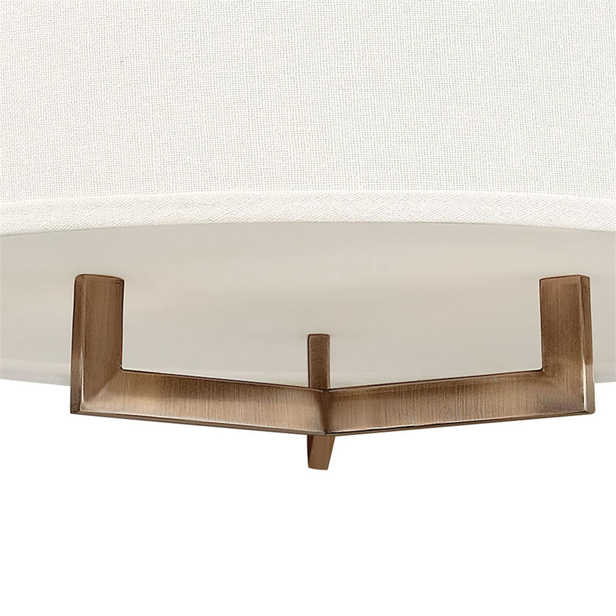 Shown in Brushed Bronze finish and Off-White Linen Hardback shade