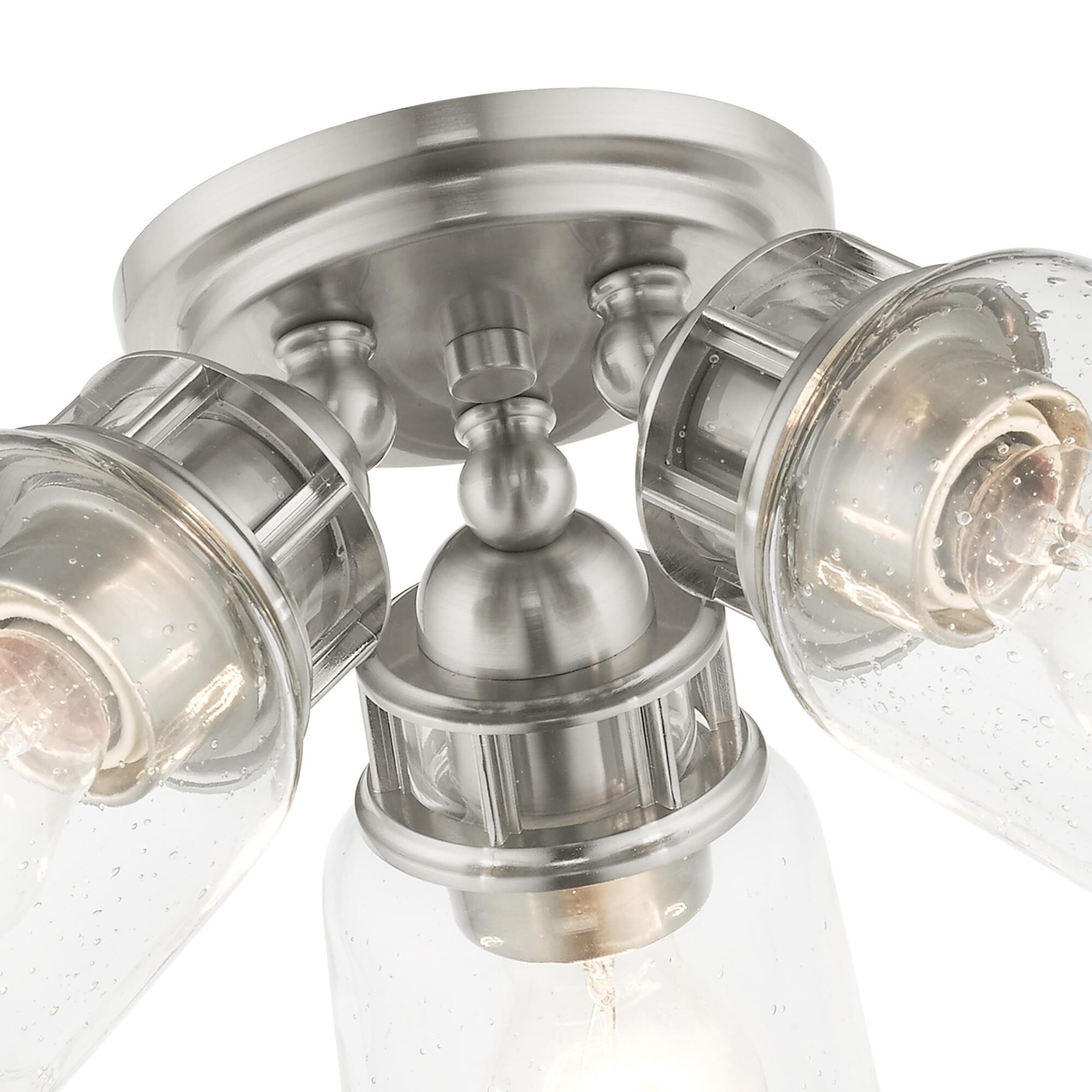 Shown in Brushed Nickel finish and Hand Blown Clear Seeded glass