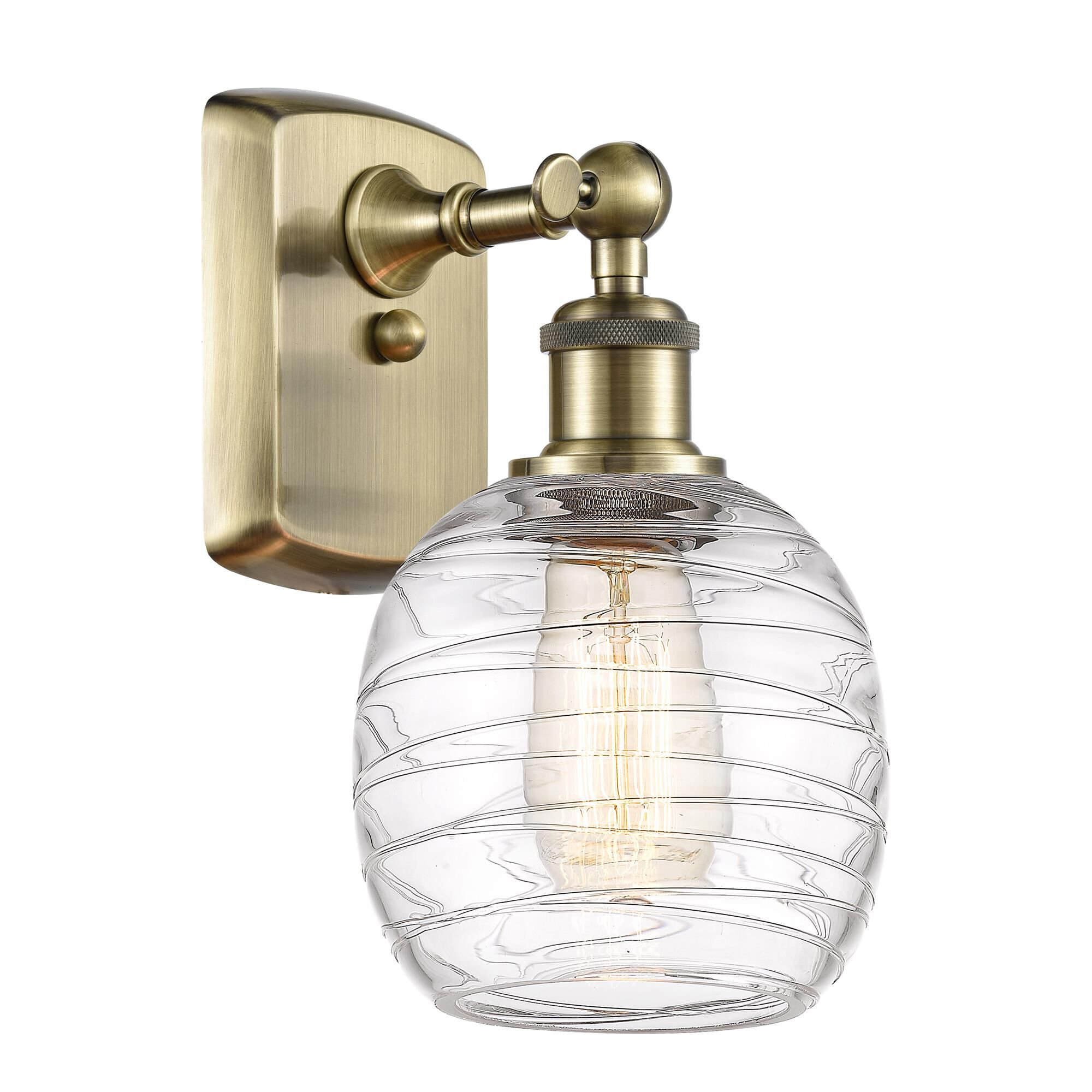 Shown in Antique Brass finish and Deco Swirl glass