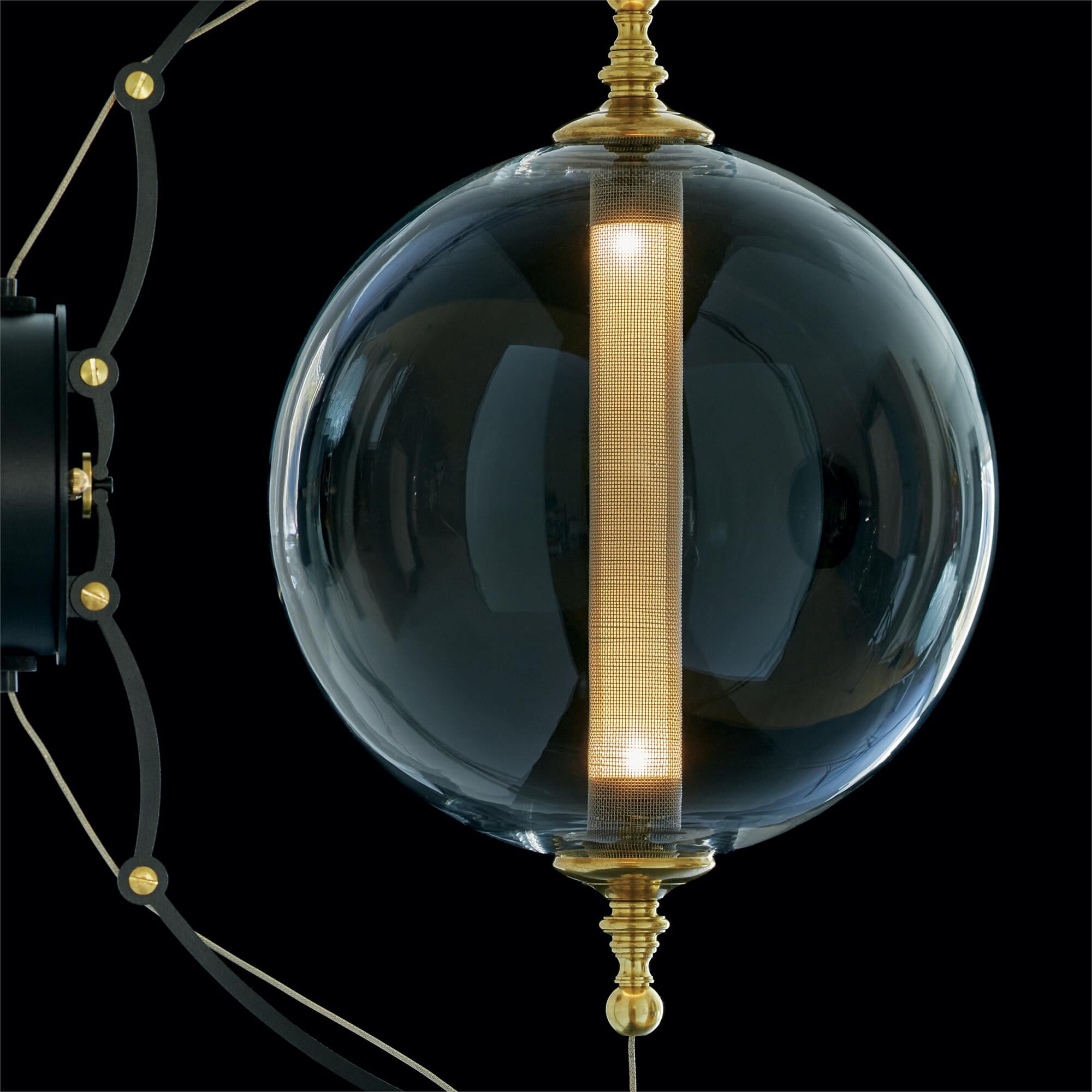 Shown in Brass with Black finish and Clear glass
