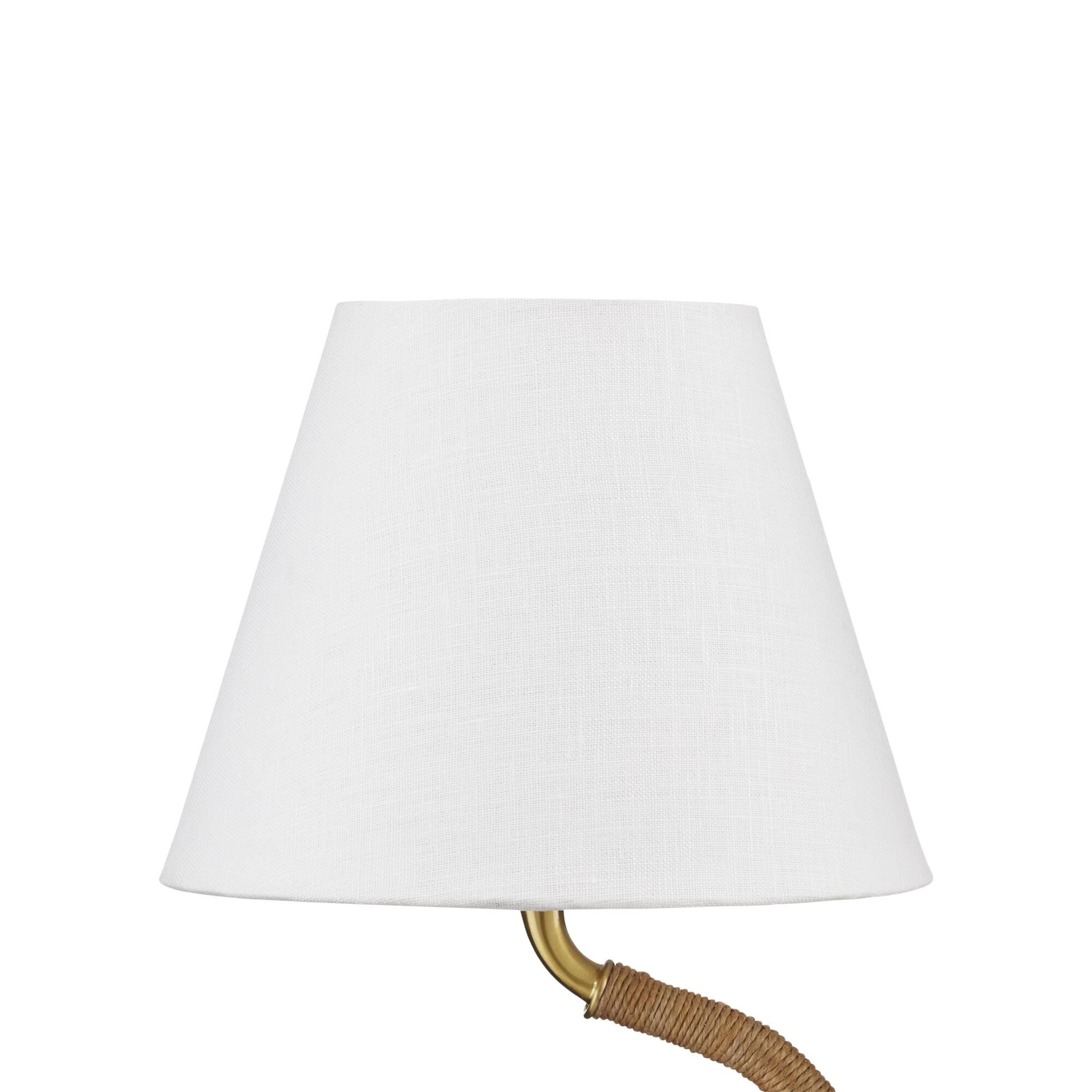 Shown in Natural/Antique Brass finish and Off-White Linen shade