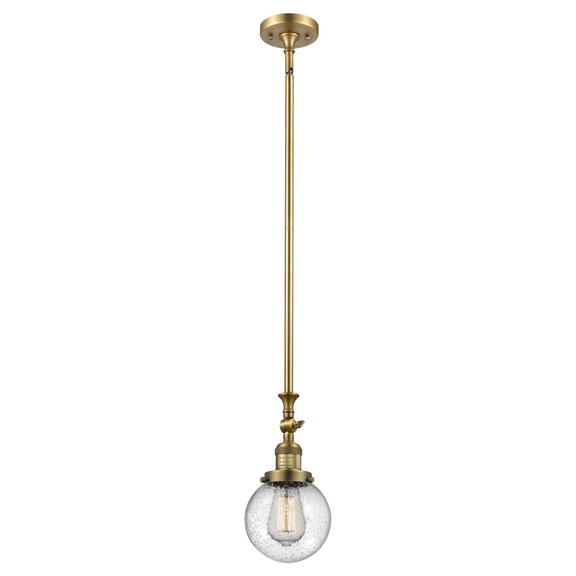 Shown in Brushed Brass finish and Seedy glass