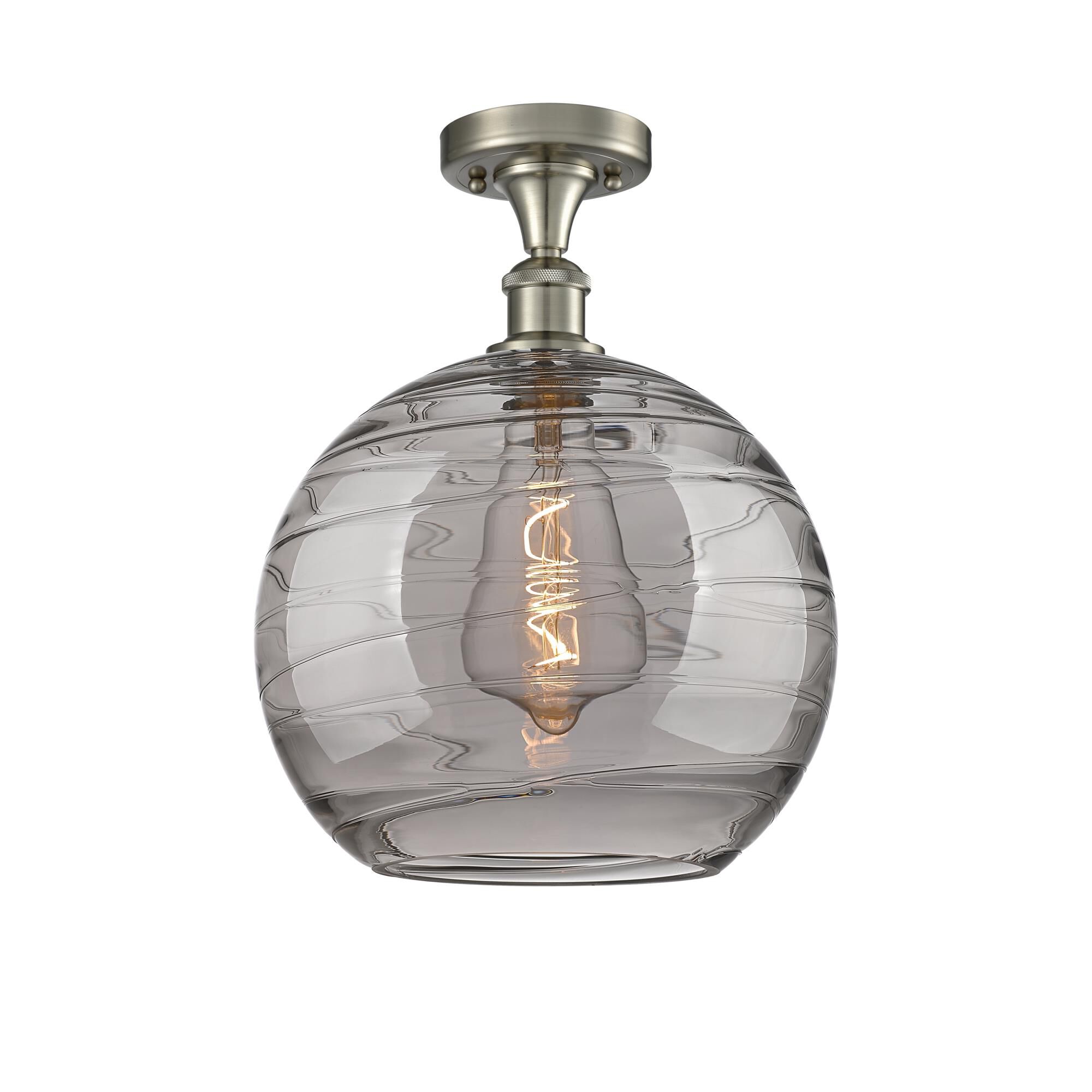 Shown in Brushed Satin Nickel finish and Light Smoke Deco Swirl glass