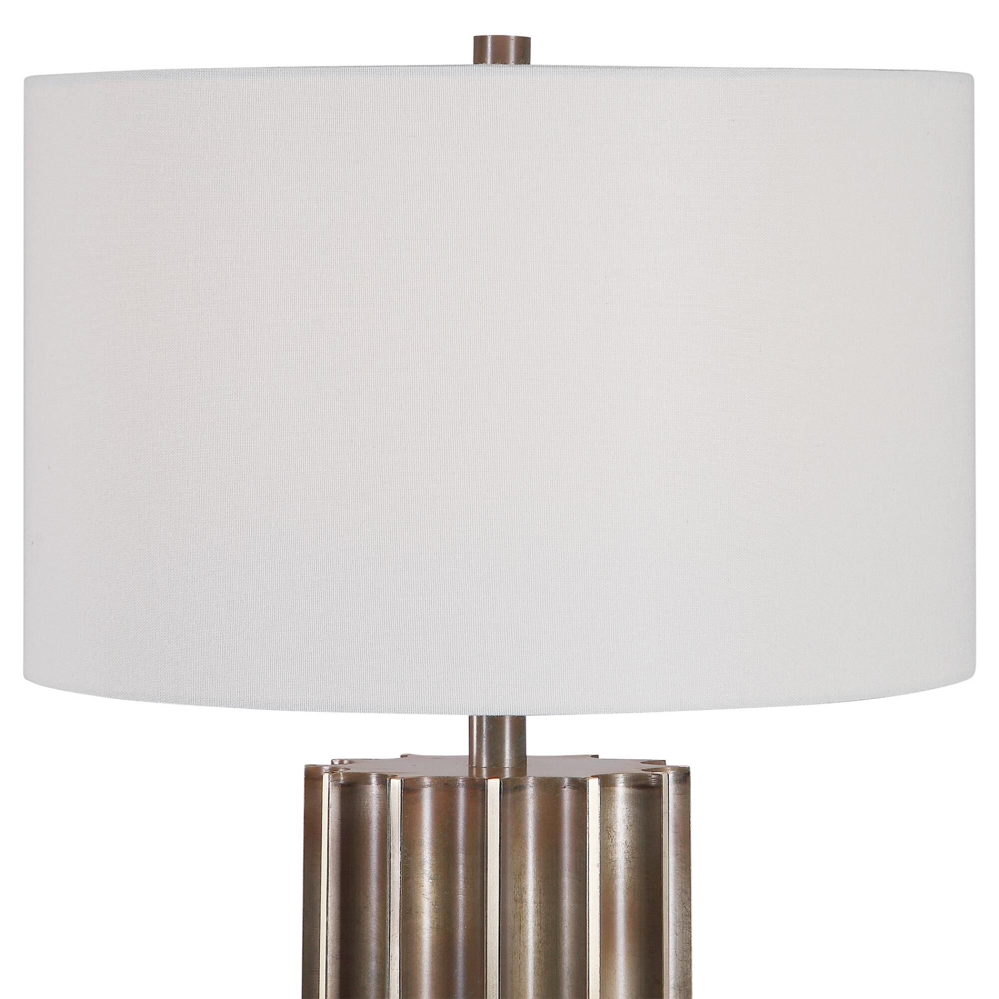 Shown in This Table Lamp Features A Deep Fluted Steel Base Finished In An Aged Gun Metal With Rust Distressin finish and Round Drum Hardback shade
