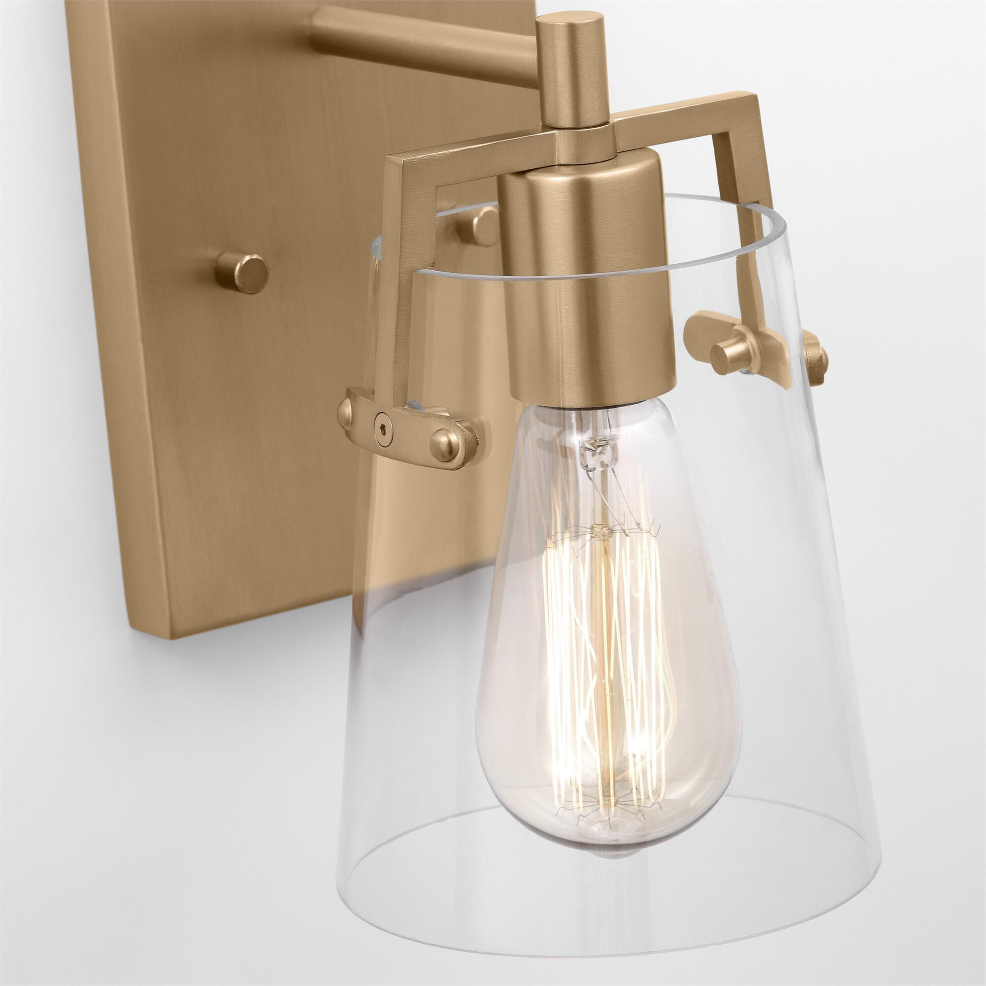 Shown in Satin Brass finish and Clear Glass shade