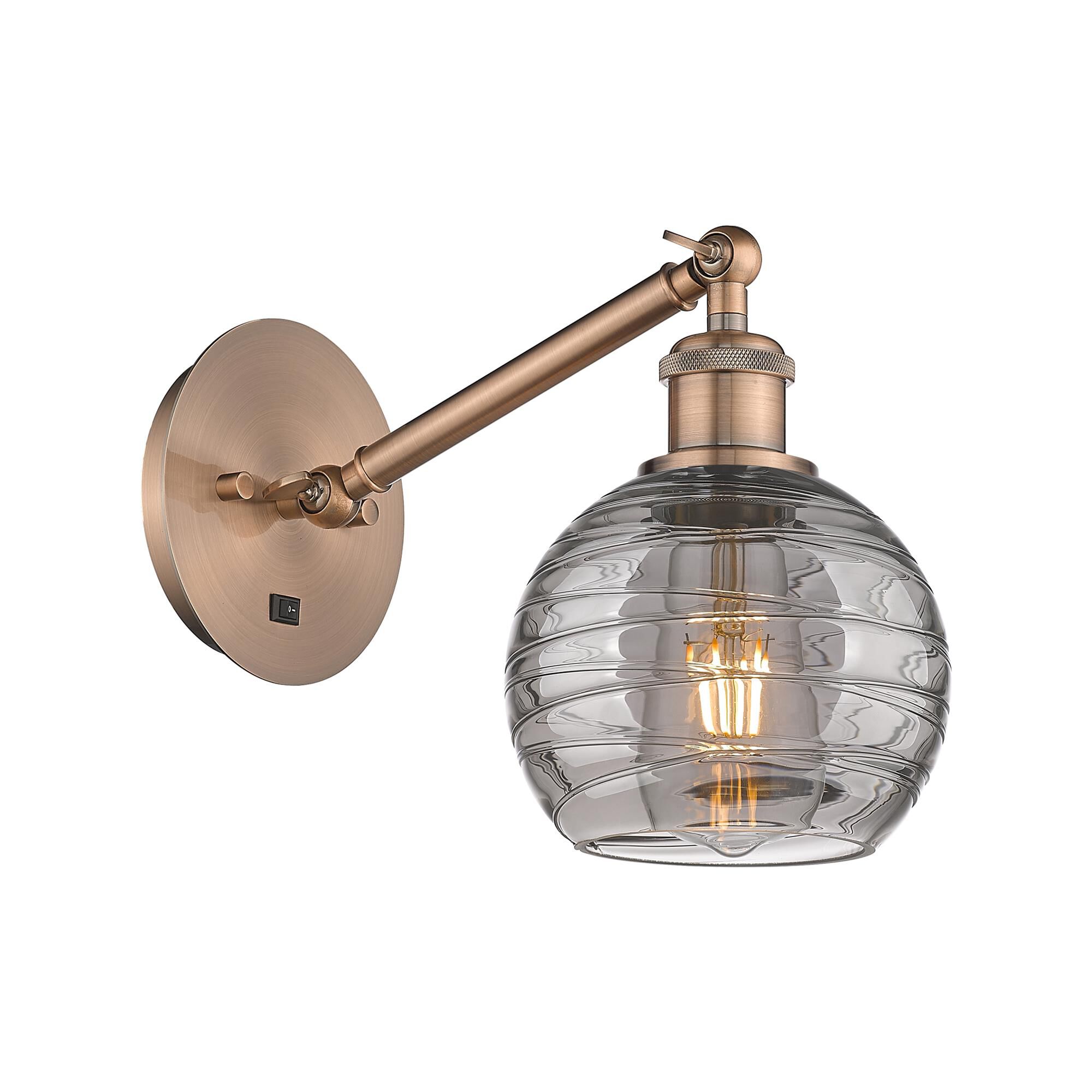 Shown in Antique Copper finish and Light Smoke Deco Swirl glass