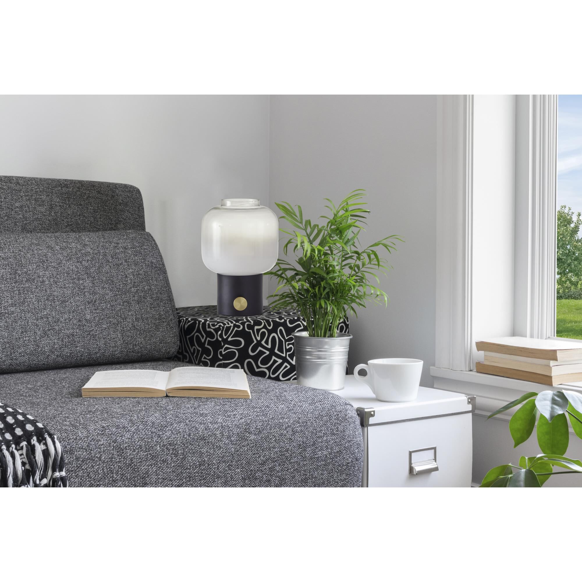 Shown in Matte Black W. Antique Brass Accent finish and Fading White to Clear glass