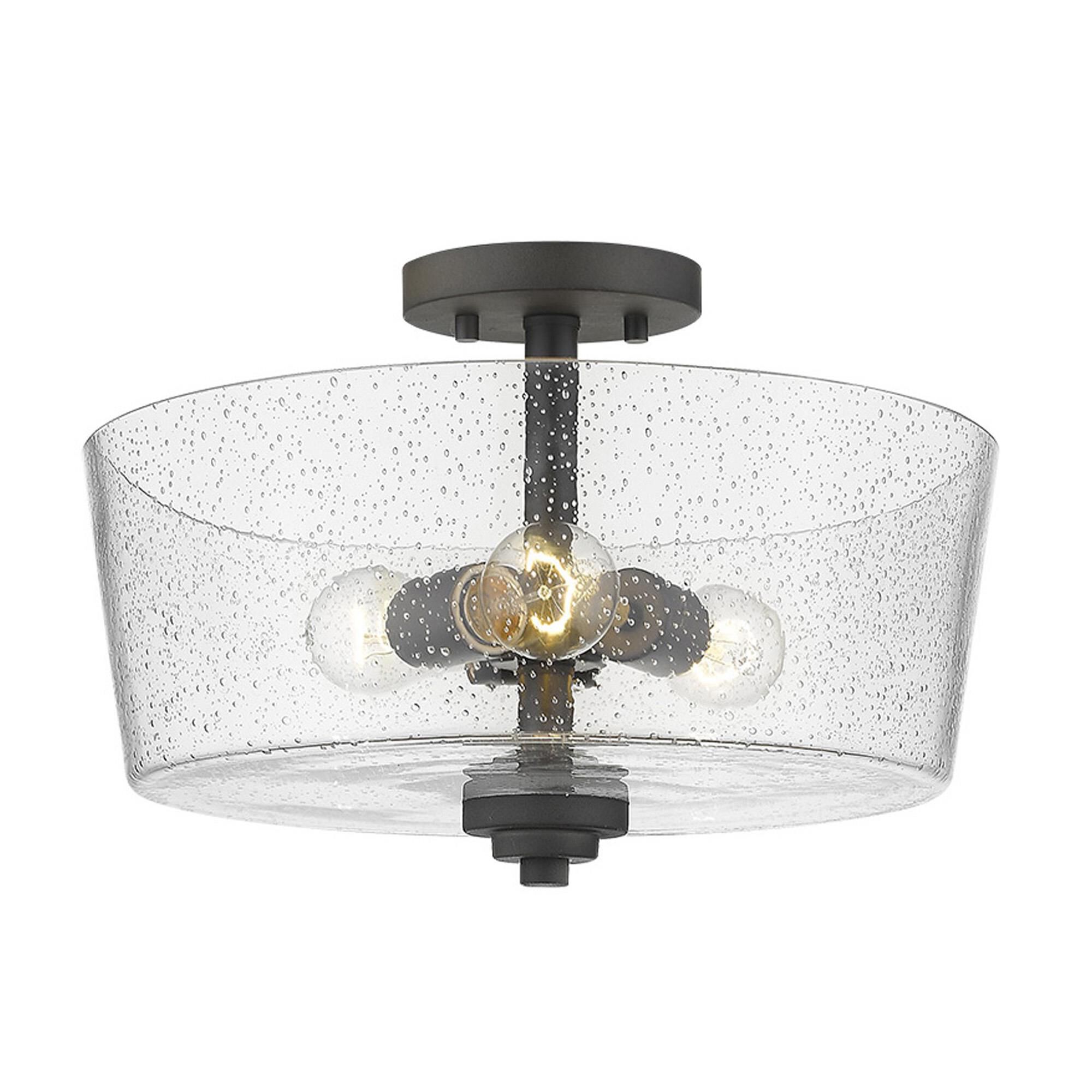 Shown in Oil-Rubbed Bronze finish and Clear glass and Clear, Seeded Drum Shaped Glass shade