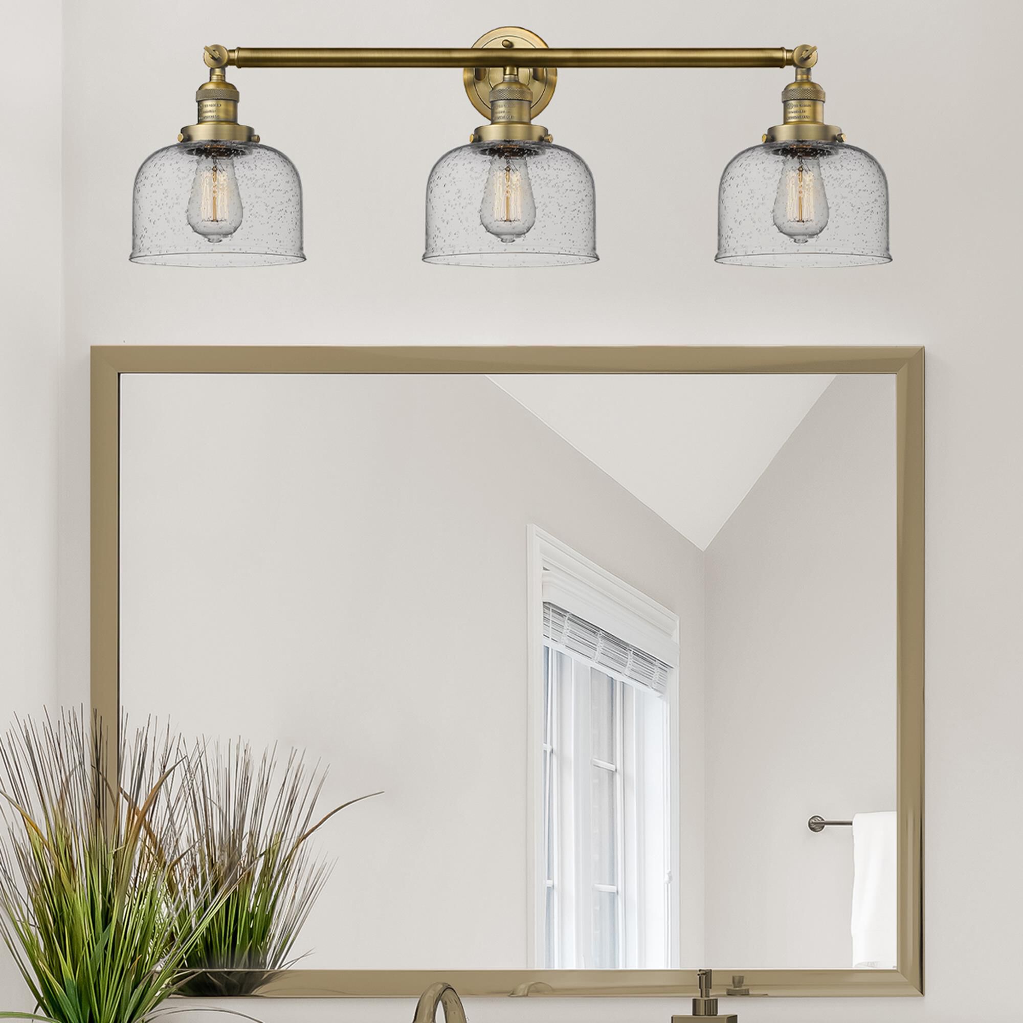 Shown in Brushed Brass finish and Seedy glass