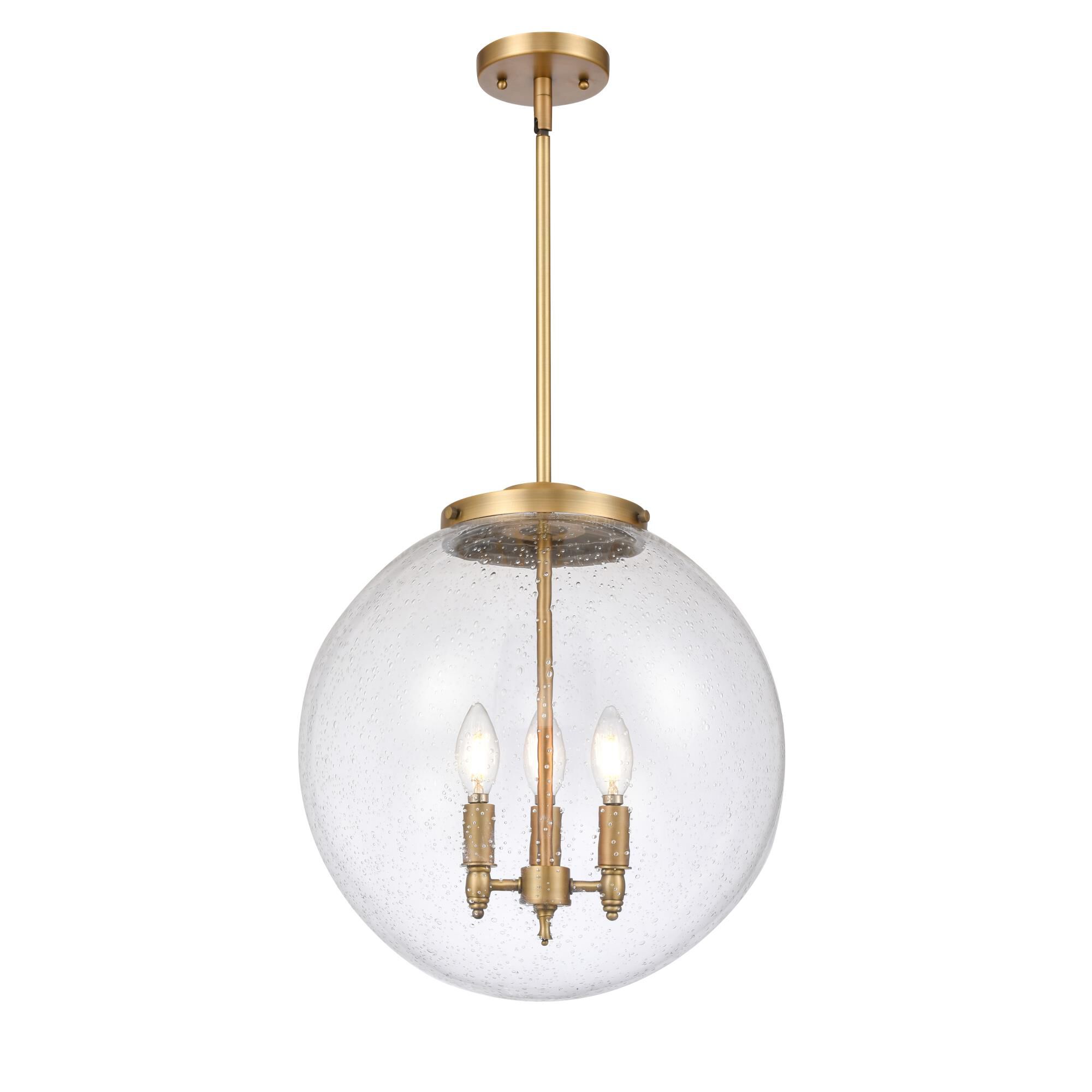 Shown in Brushed Brass finish and Seedy glass