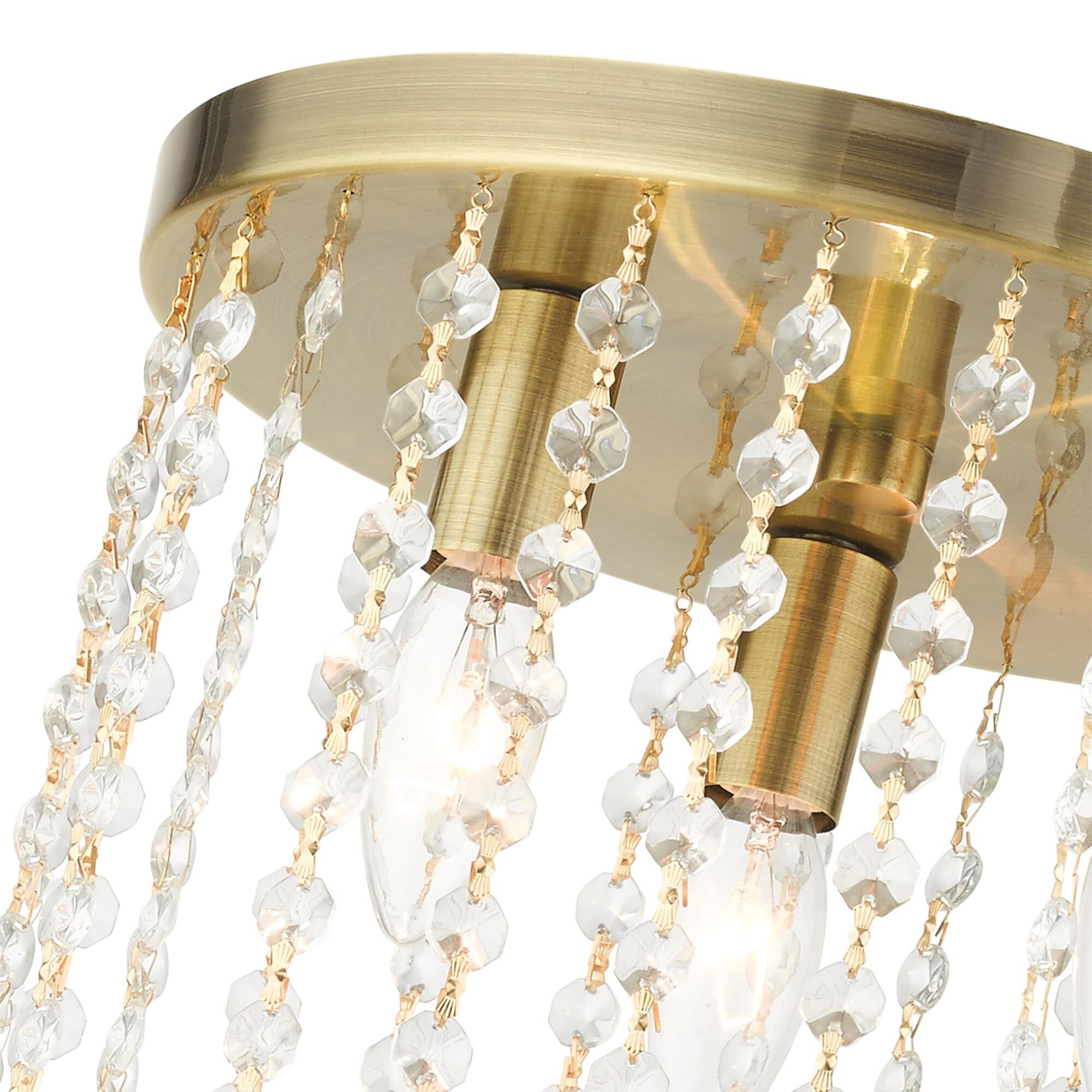 Shown in Antique Brass finish and Hand Assembled Crystal Shade glass