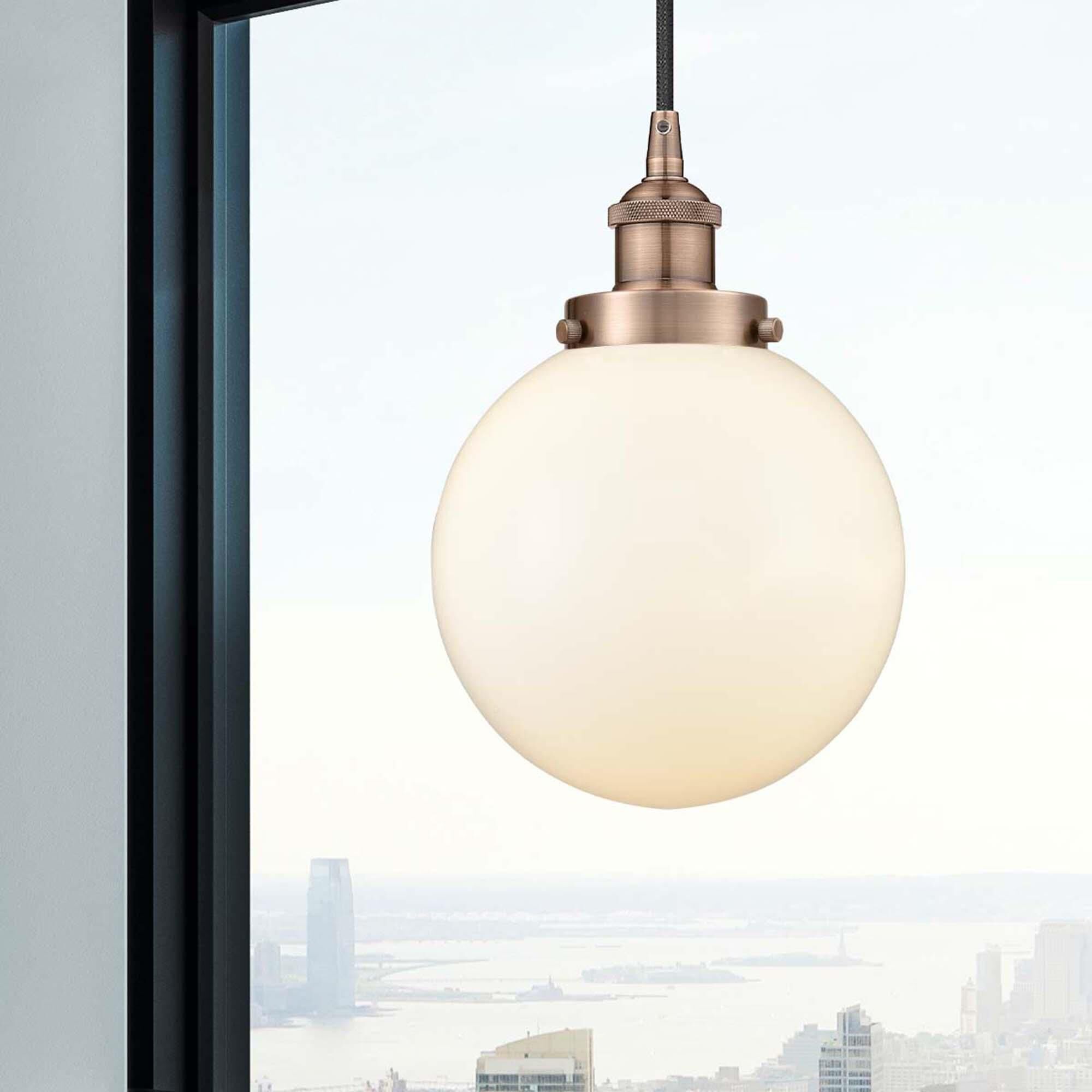 Shown in Antique Copper finish and Matte White Cased Beacon glass