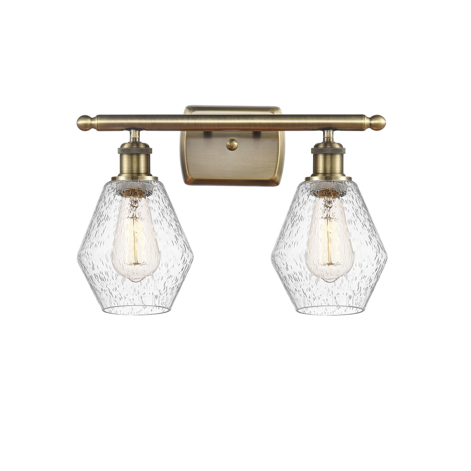 Shown in Antique Brass  finish and Seedy glass
