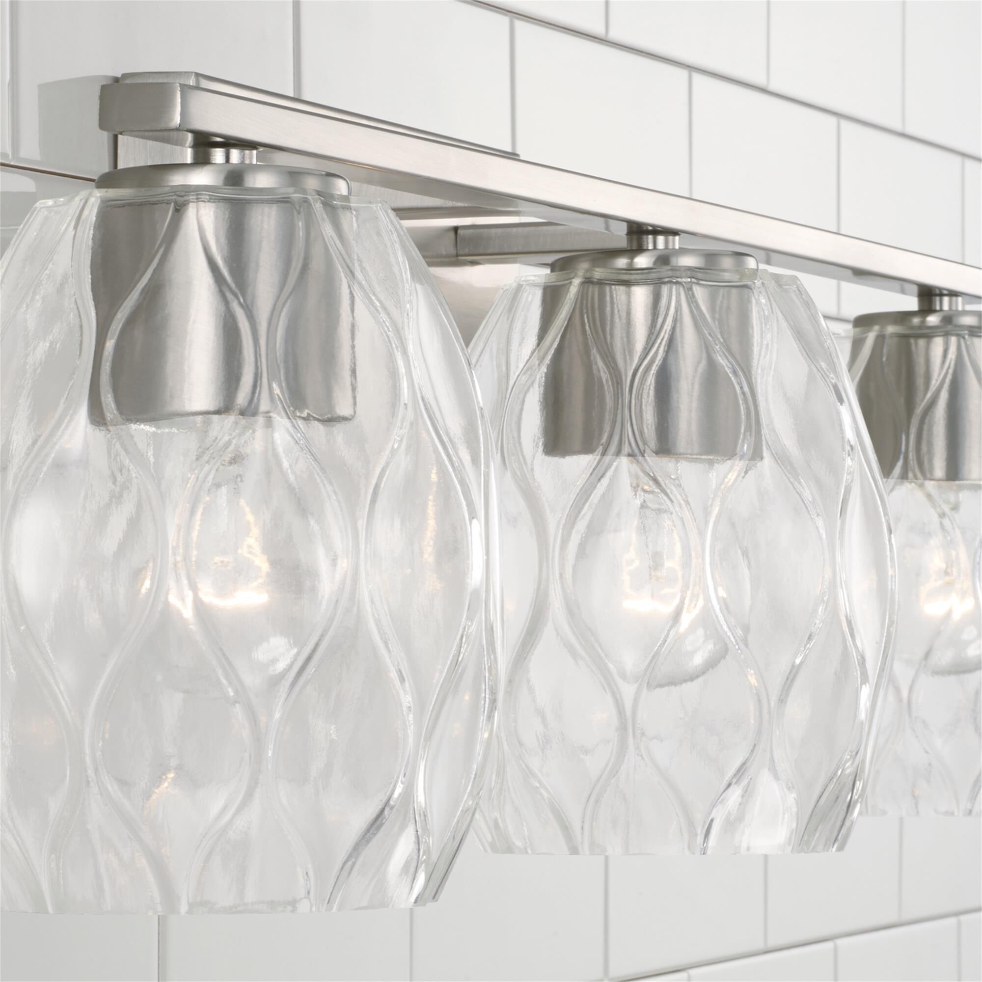 Shown in Brushed Nickel finish and Wavy Embossed glass