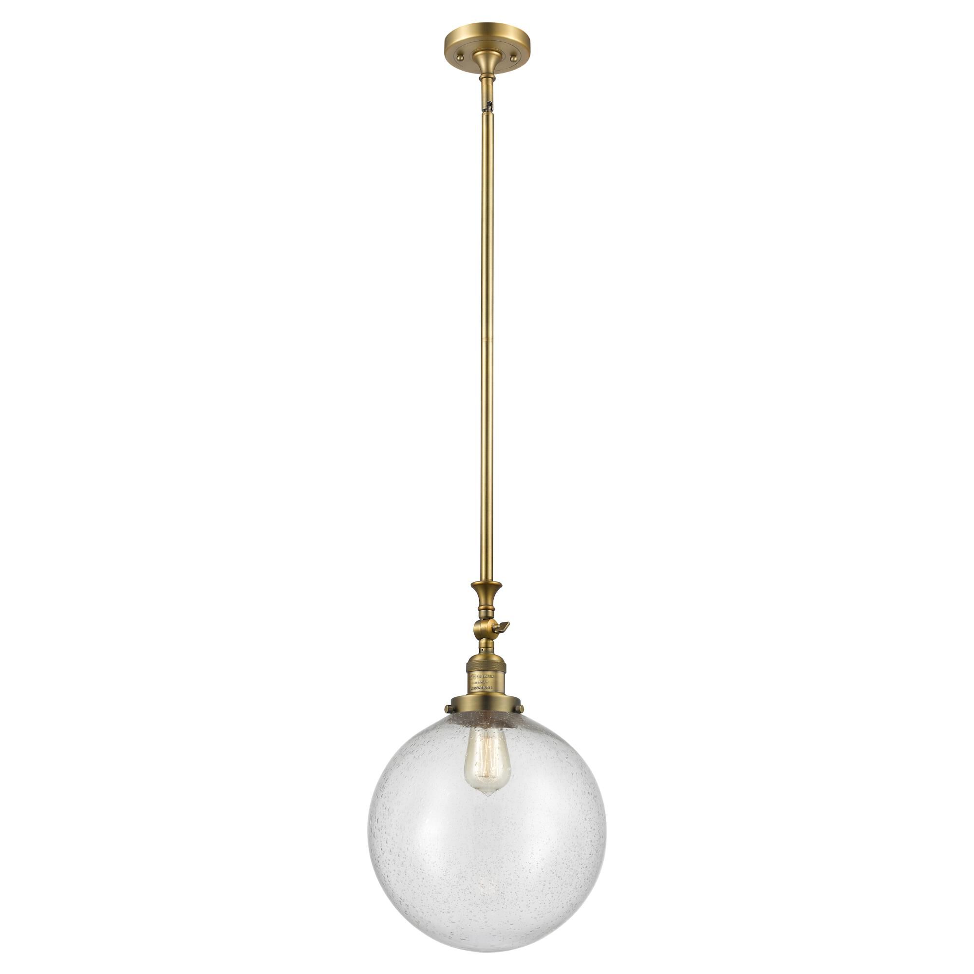 Shown in Brushed Brass finish and Seedy Beacon glass