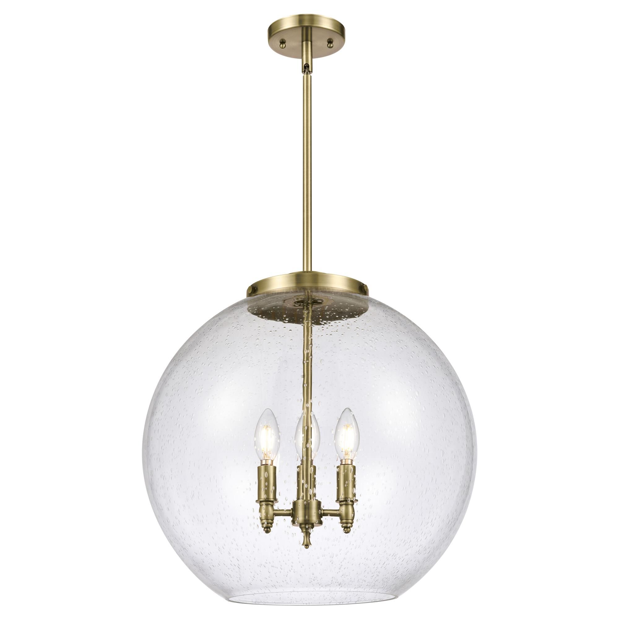 Shown in Antique Brass finish and Seedy glass